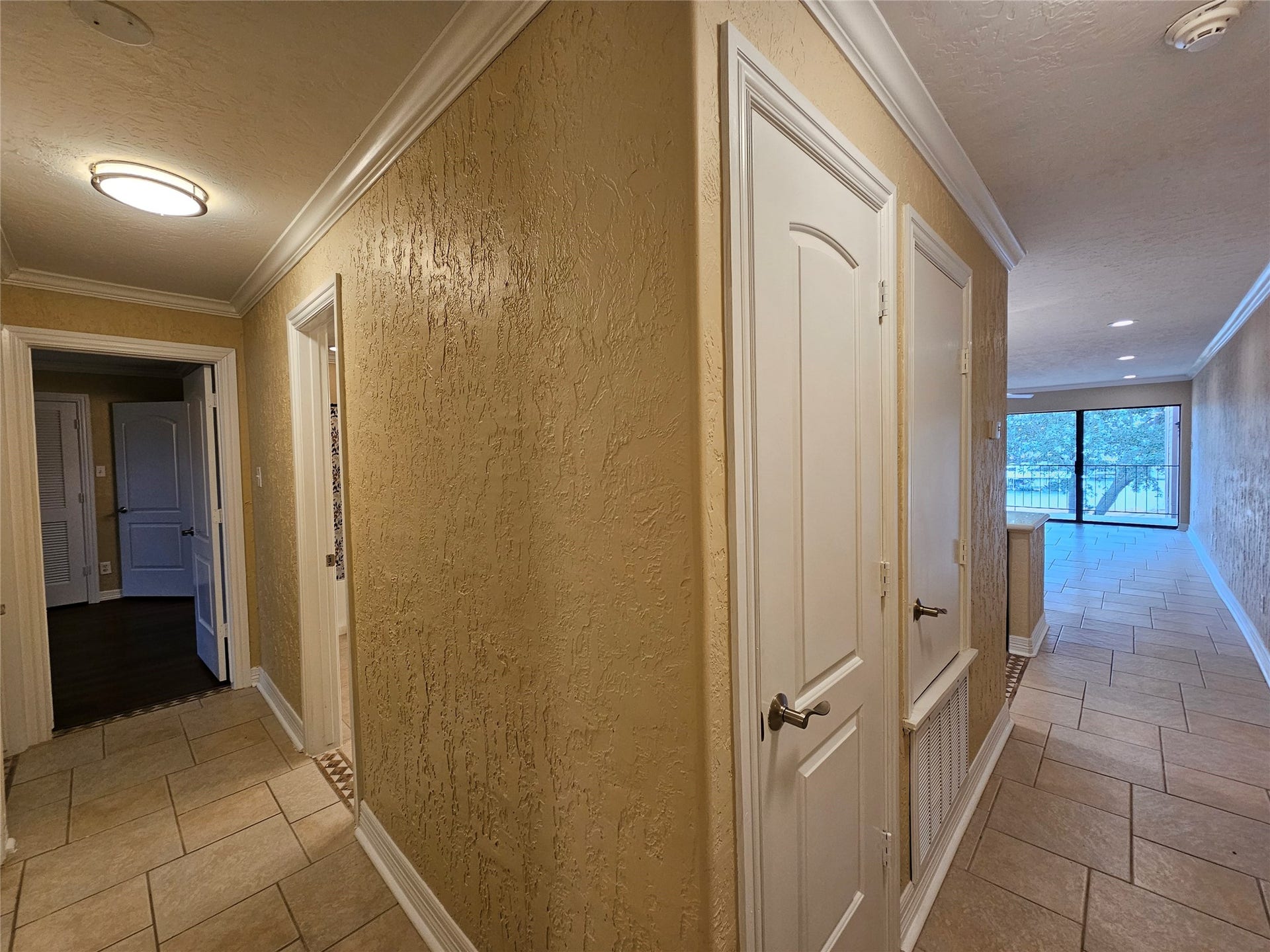 15575 Marina Drive, #323A, Conroe, TX 77356 Views of the hallway leading to 2 bedrooms and 2 bathrooms along with the washer/dryer.
