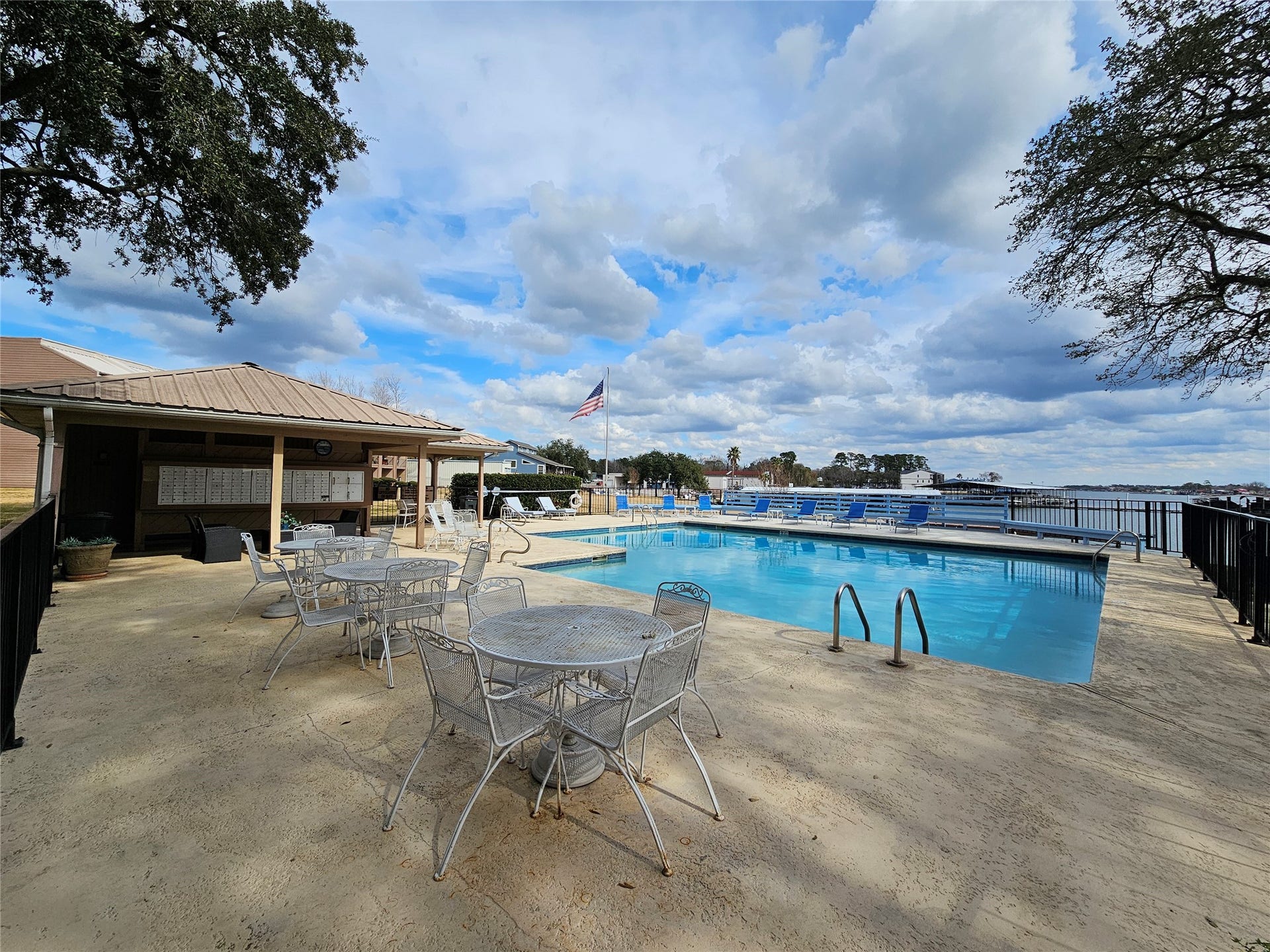15575 Marina Drive, #323A, Conroe, TX 77356 Community pool with plenty of seating and a grilling area.
