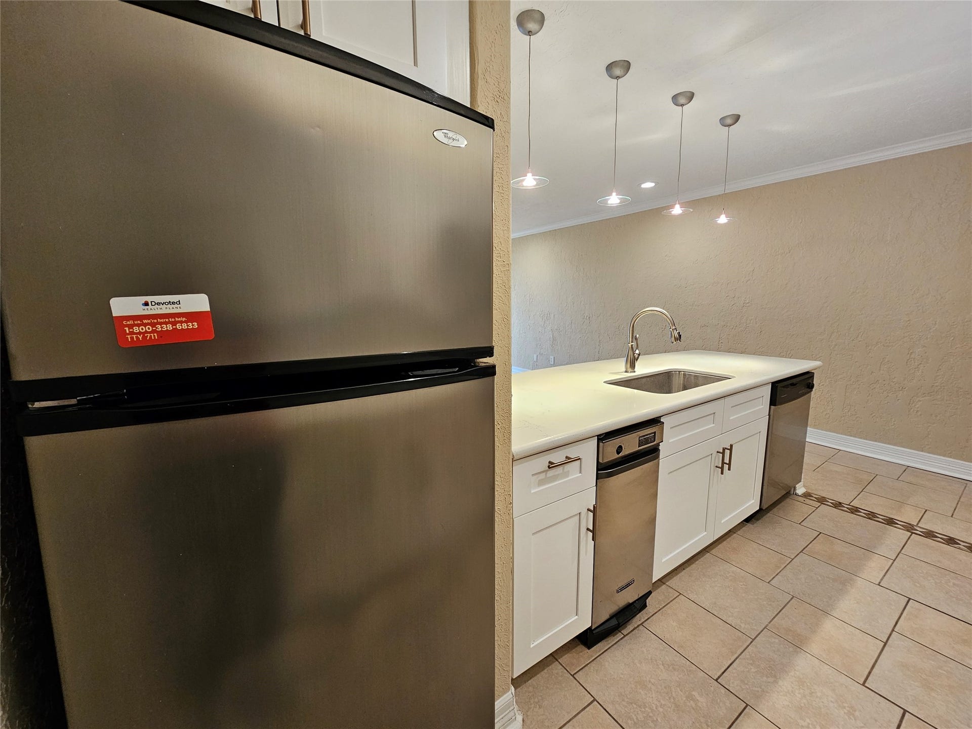 15575 Marina Drive, #323A, Conroe, TX 77356 Additional views of the kitchen. Notice the beautiful pendant lighting and large sink with garbage disposal.