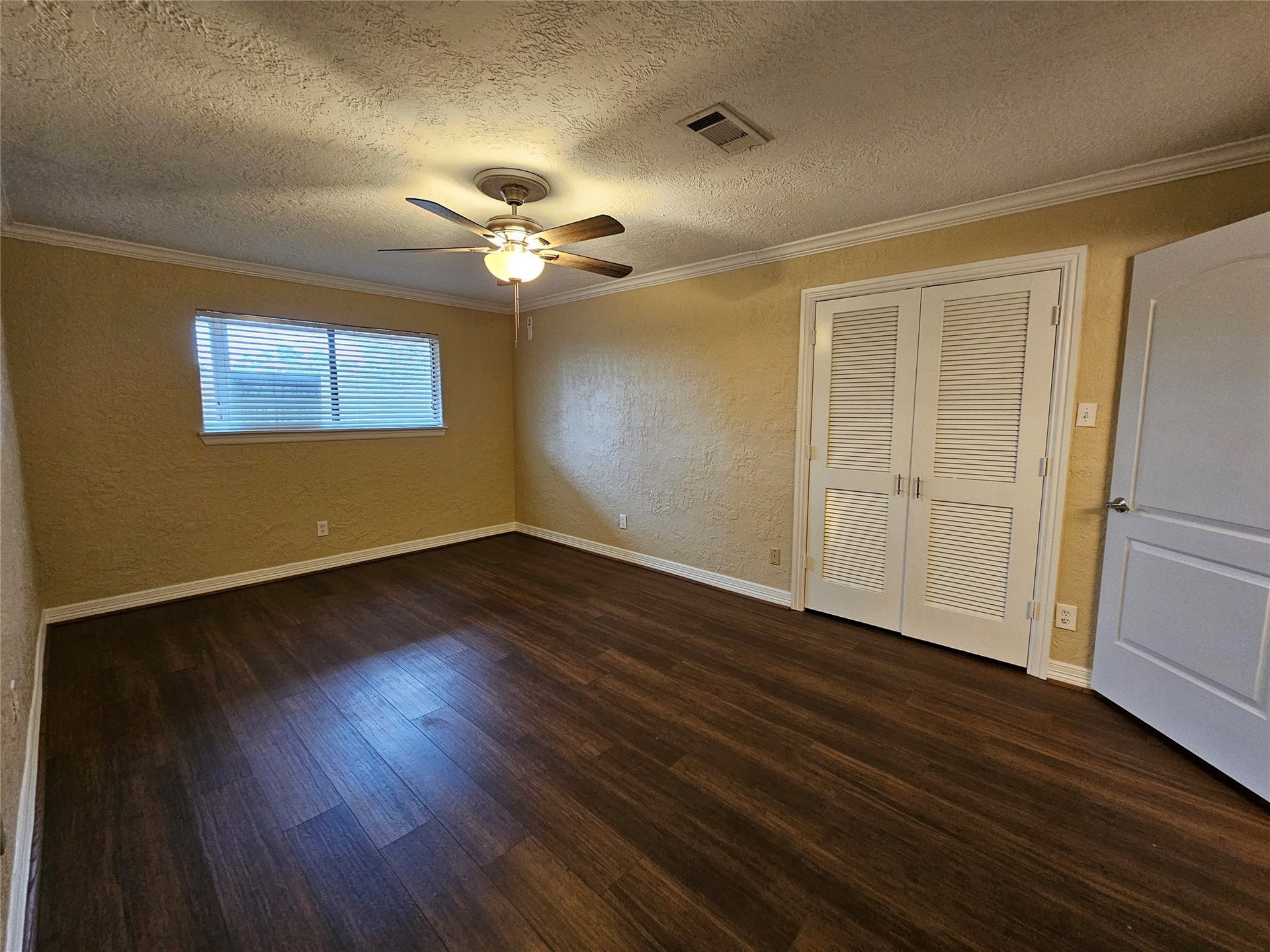 15575 Marina Drive, #323A, Conroe, TX 77356 Primary bedroom with wood flooring and large closet.