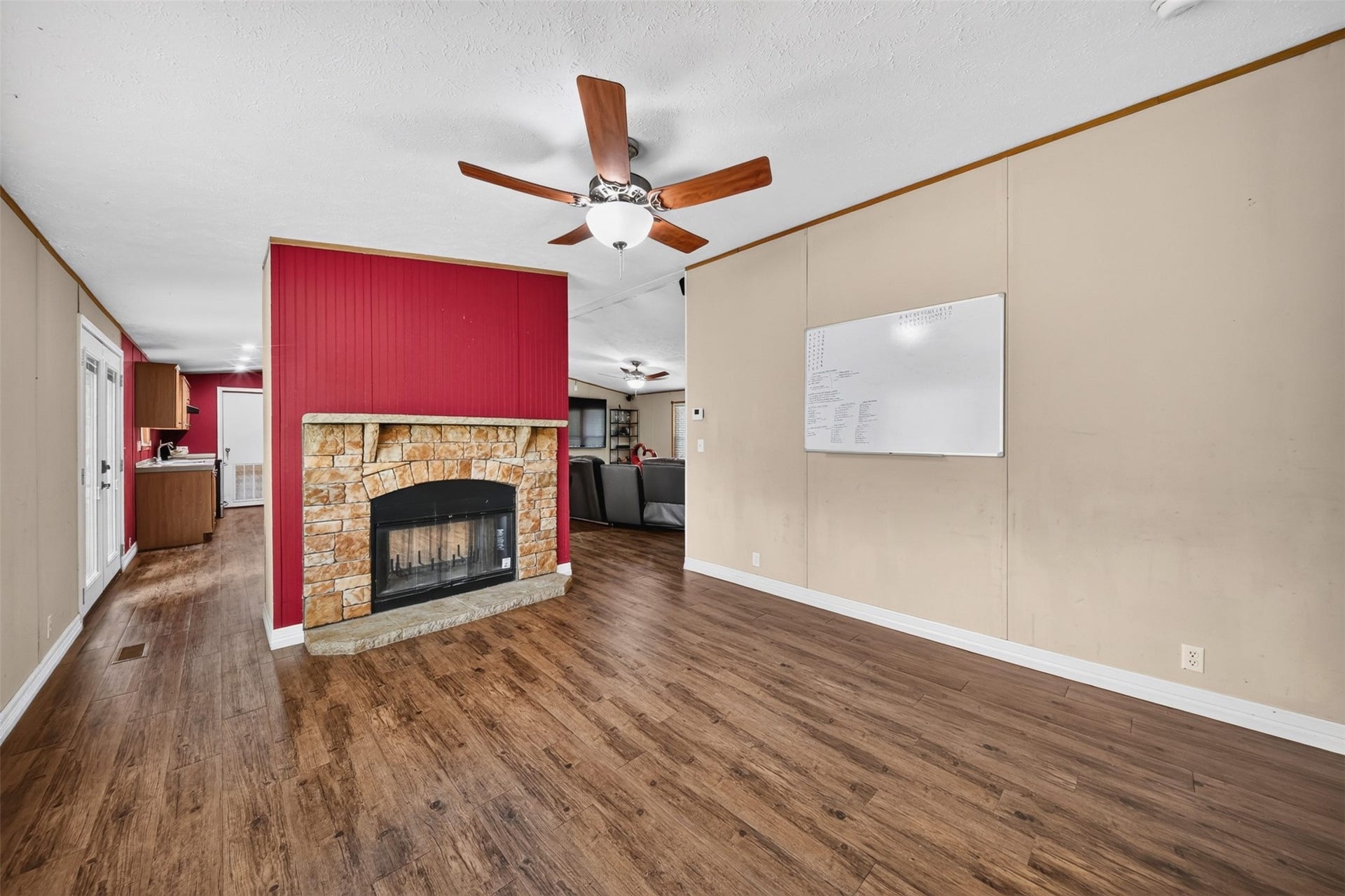 2581 Mann Road, Conroe, TX 77303 Spacious living area with fireplace and flexible room for multiple furniture arrangements.