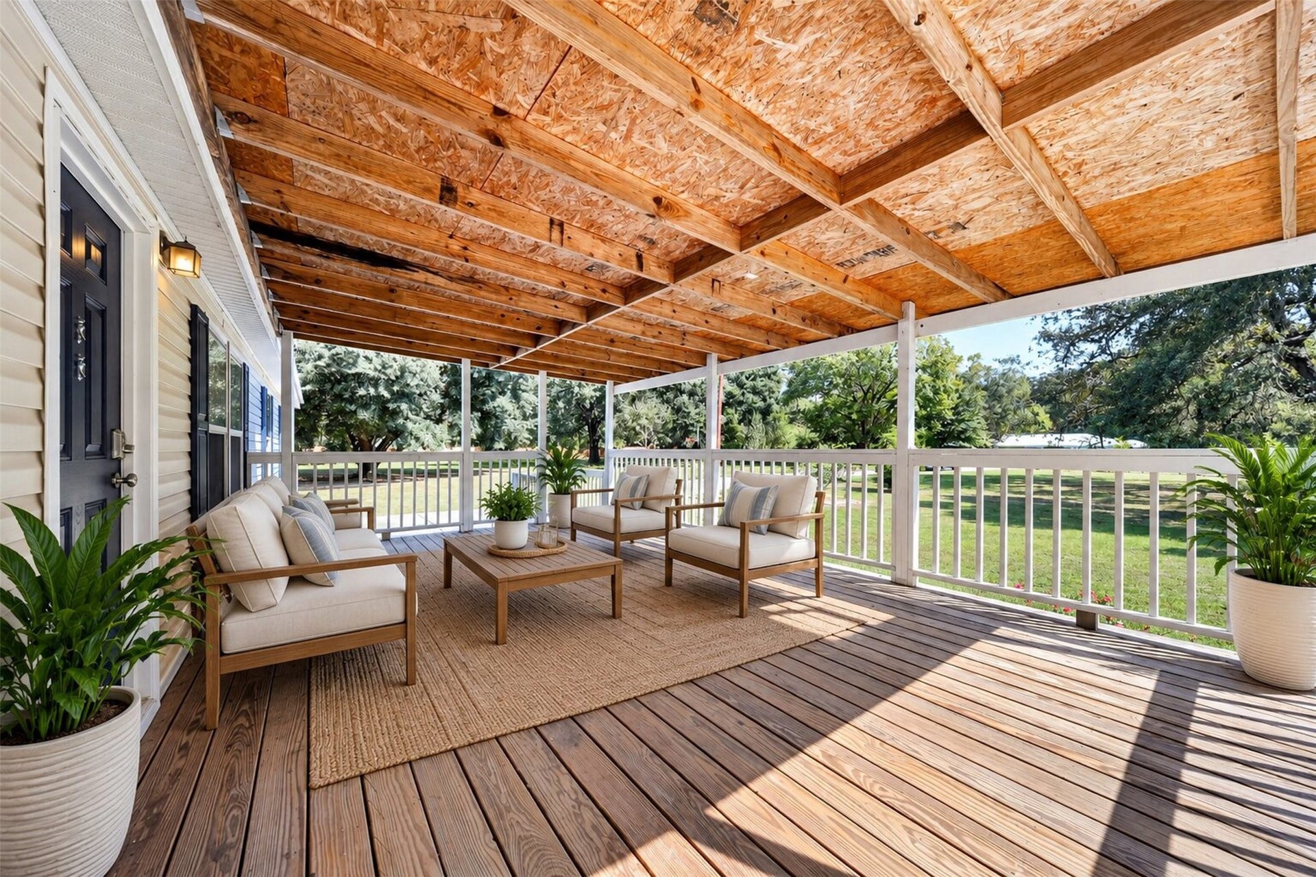 2581 Mann Road, Conroe, TX 77303 Virtually staged covered deck showcasing the potential for outdoor seating, dining, and entertaining.