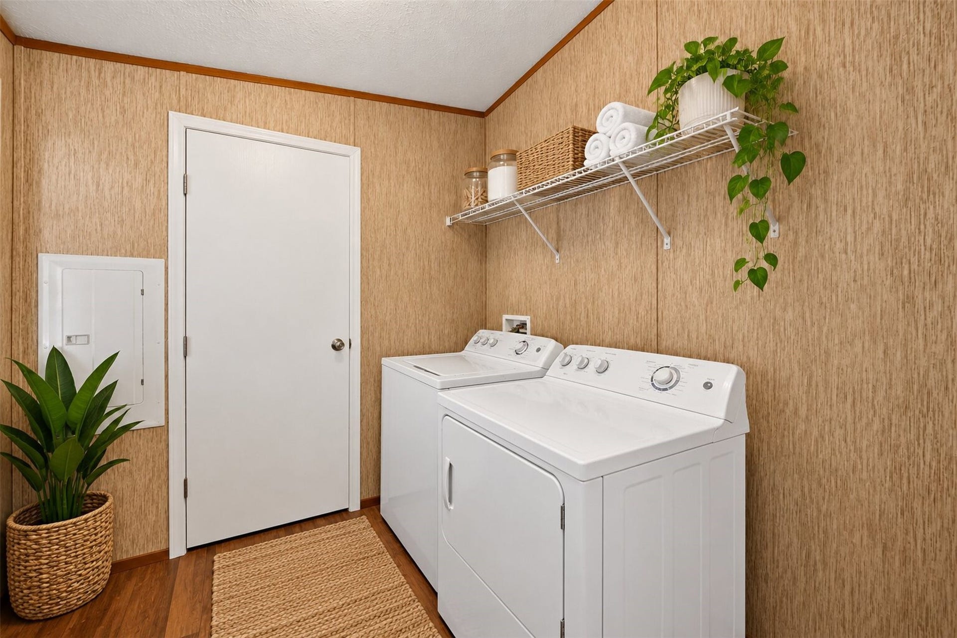 2581 Mann Road, Conroe, TX 77303 Virtually staged utility room with washer and dryer connections and additional storage space.