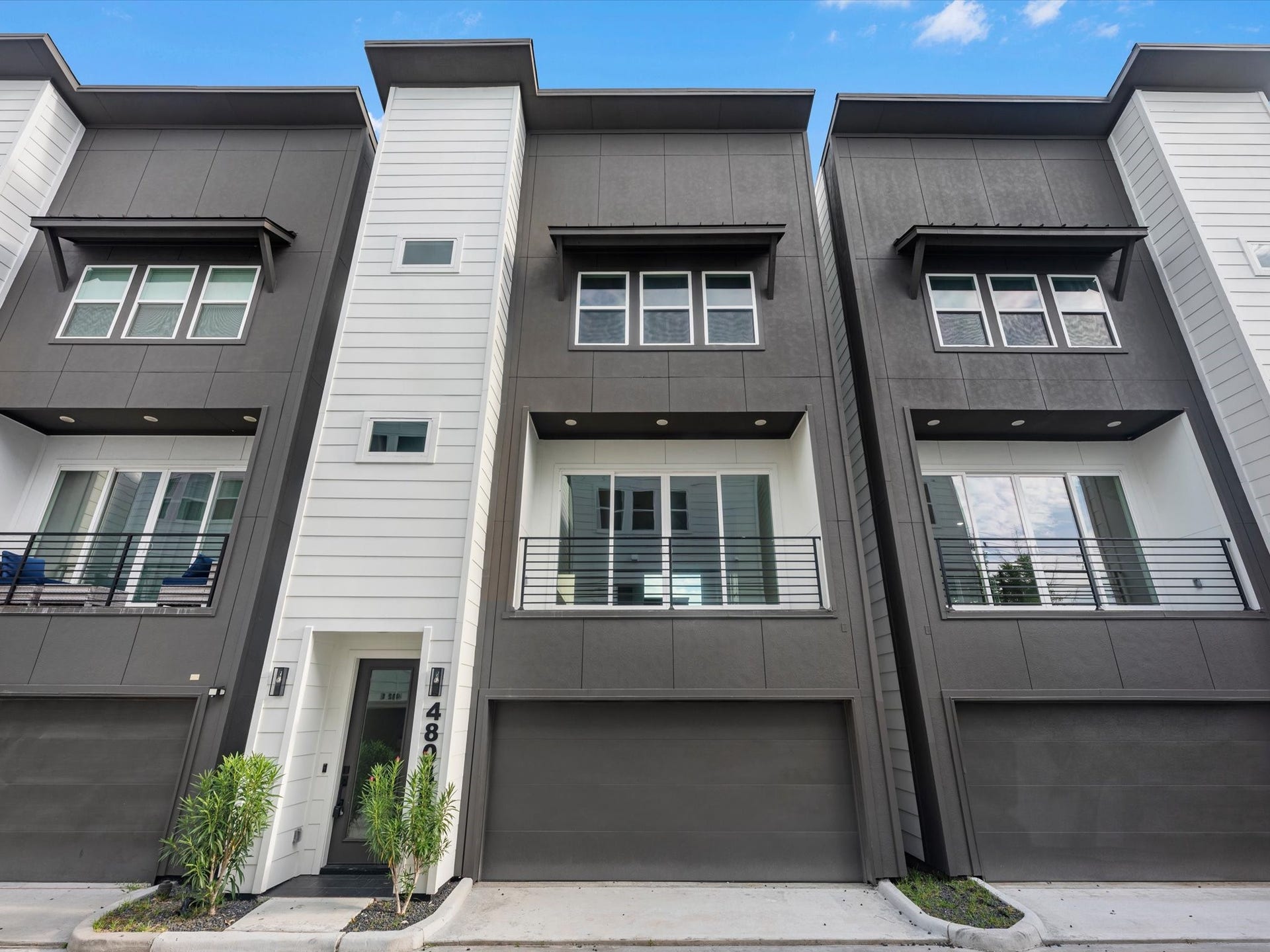 Beautiful exterior of this 3-bedroom, 3.5-bath home featuring a private balcony and a gated community setting. Located inside the Loop with easy access to major highways, dining, shopping, and everything Houston has to offer.