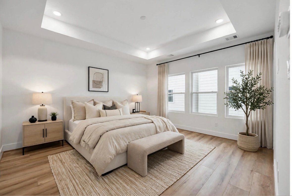 Private and spacious primary bedroom featuring beautiful tray ceilings and a peaceful third-floor location. Set apart from the main living spaces, the third-floor primary suite offers added privacy and a comfortable retreat.
