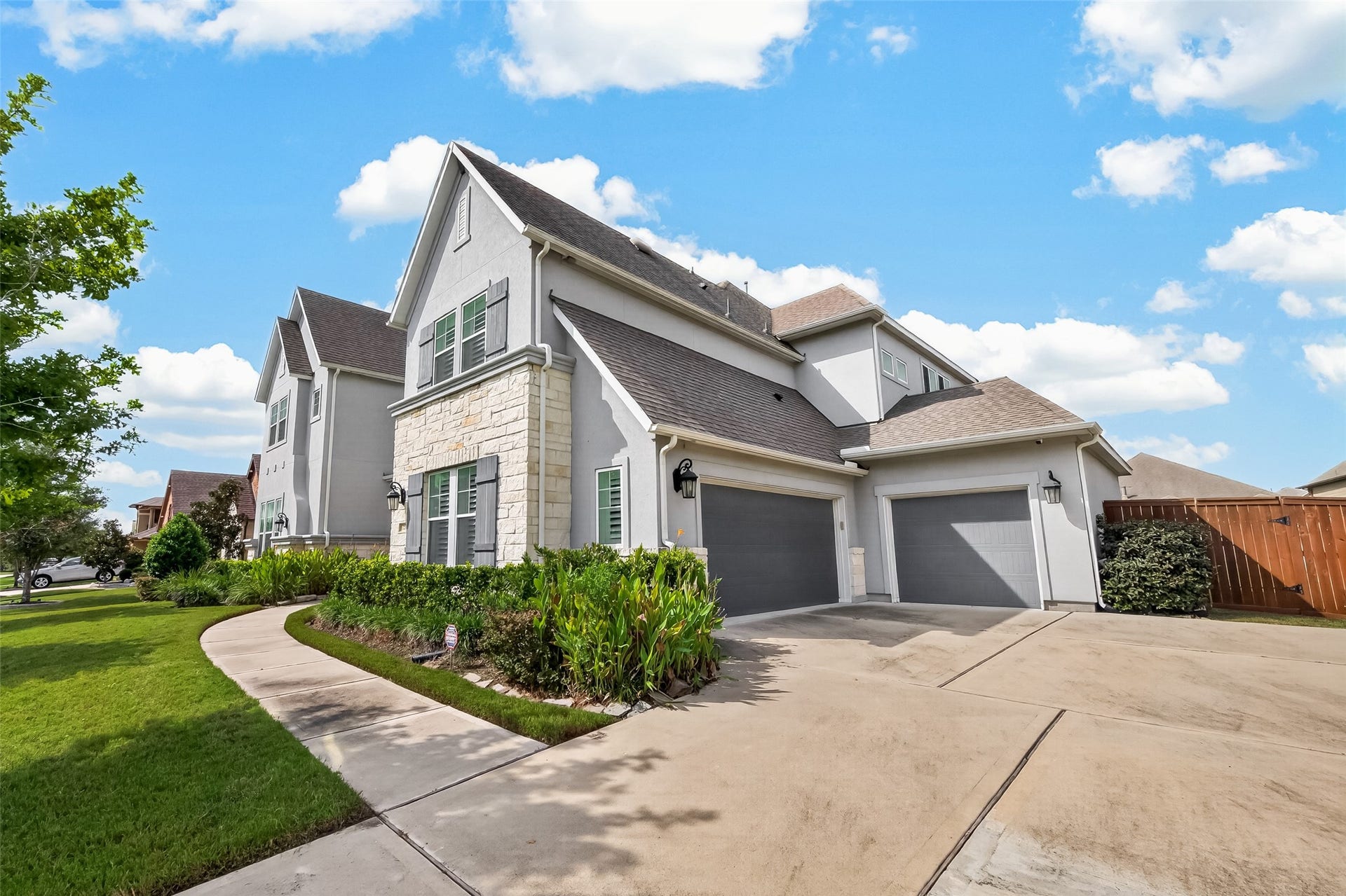 11219 Elm Creek Falls Court, Cypress, TX 77433 3 car garage and long driveway in gated section.
