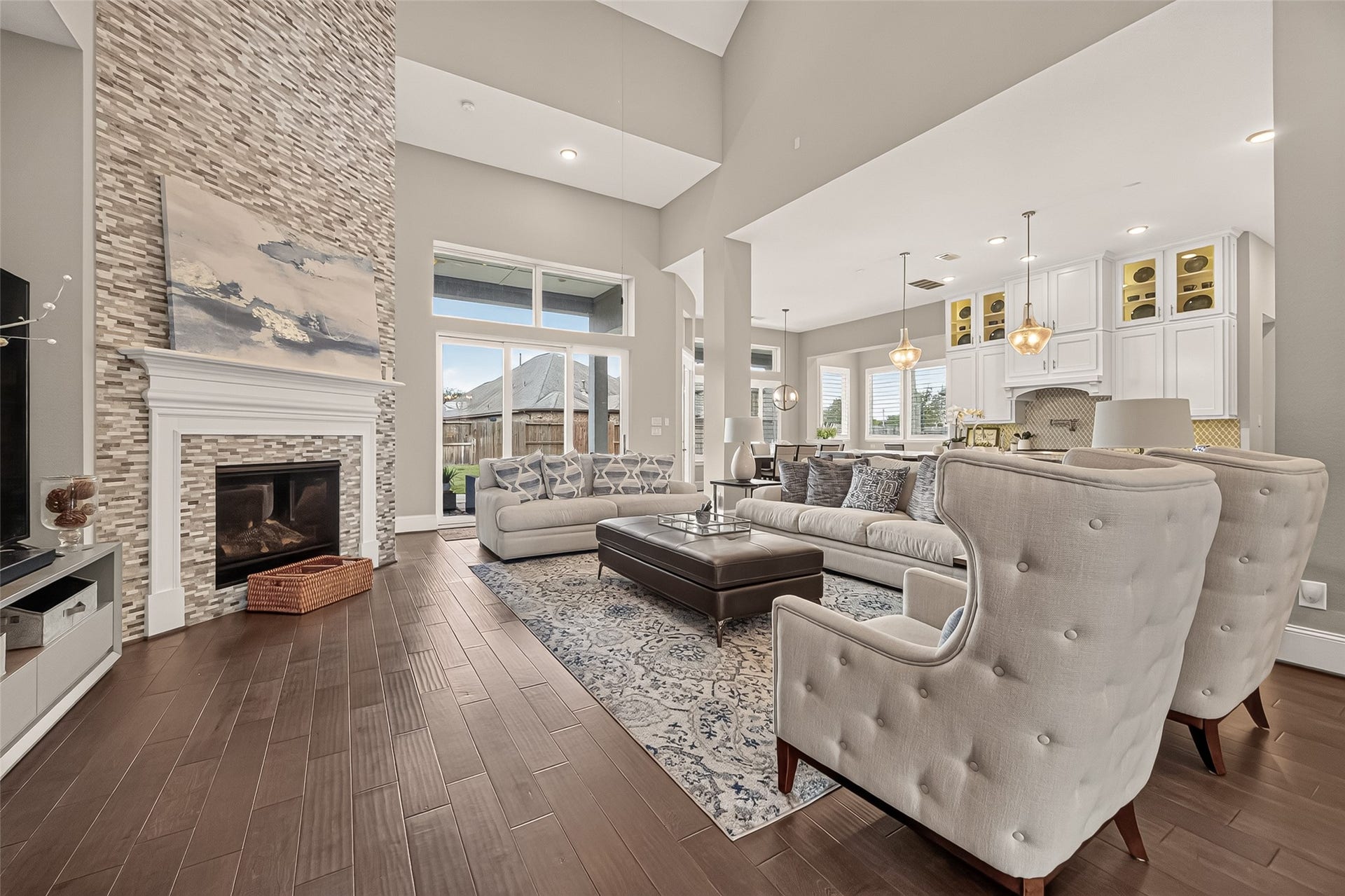 11219 Elm Creek Falls Court, Cypress, TX 77433 Family room is in the center of the house with a cozy fireplace.