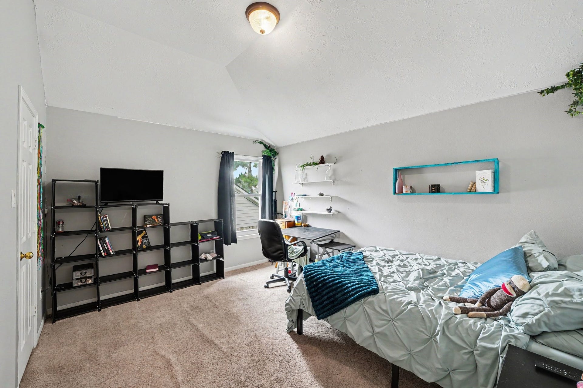 12807 Rocky Briar Lane, Tomball, TX 77377 This secondary bedroom offers plenty of flexibility for family or guests, with a ceiling fan, natural light, and room for a variety of furniture arrangements.