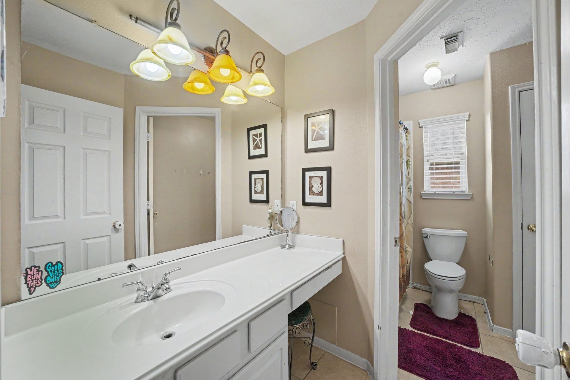12807 Rocky Briar Lane, Tomball, TX 77377 The upstairs full bathroom features a dual-sink vanity, ample counter space, and a separate tub/shower area, making it convenient for family and guests.