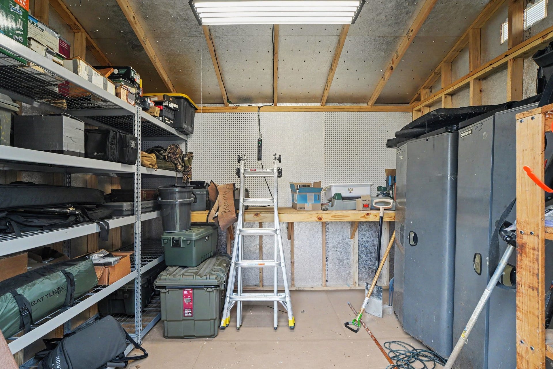 12807 Rocky Briar Lane, Tomball, TX 77377 An inside look at the 1012 Tuff Shed showcases the built-in shelving and ample storage space, perfect for keeping tools, equipment, and seasonal items organized.