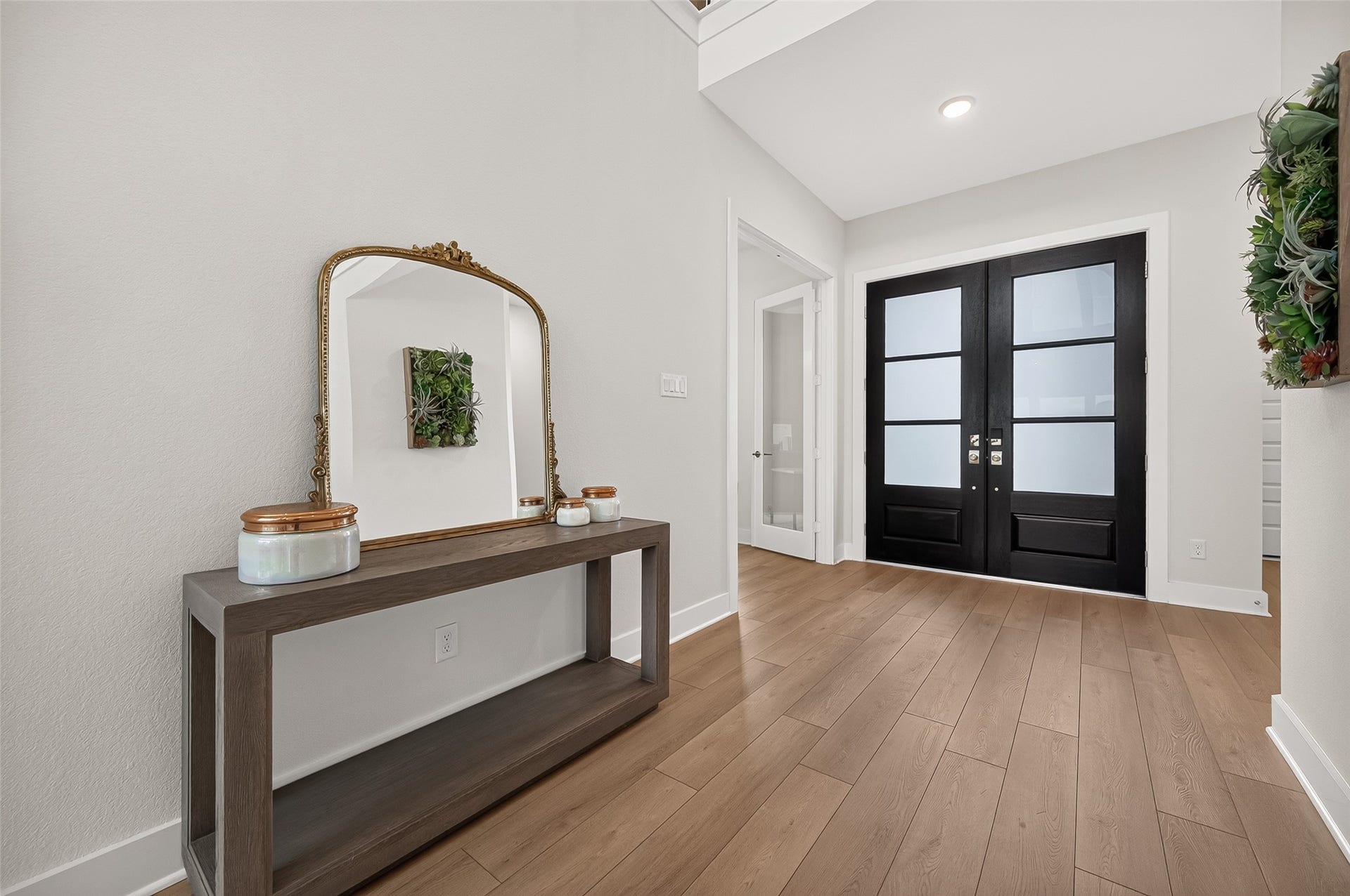 2710 Berry Basket Trail, Richmond, TX 77406 Bright and Open foyer! Gorgeous floating wood-look plank flooring flows seamlessly throughout the main living areas, complemented by plush carpeting in the bedrooms and upstairs for an added touch of warmth and comfort.