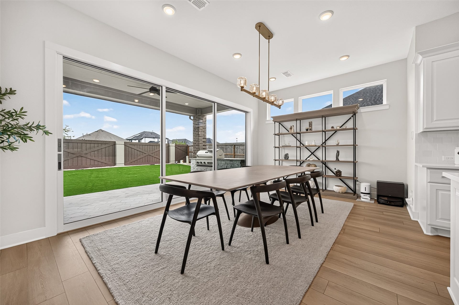2710 Berry Basket Trail, Richmond, TX 77406 The spacious dining area features sliding doors that open to the backyard patio.
