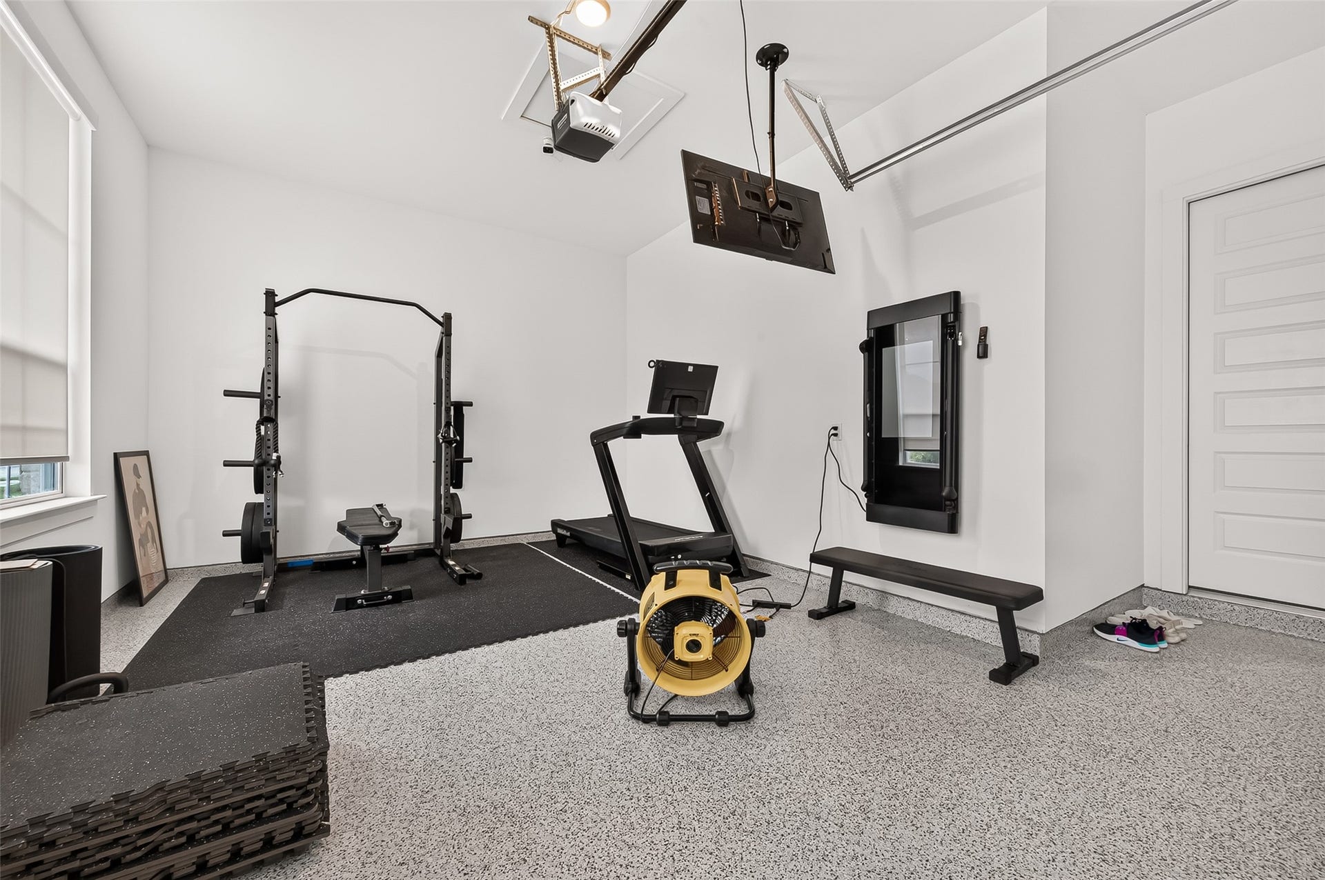 2710 Berry Basket Trail, Richmond, TX 77406 The property also a three-car garage! Shown here, additional single detached garage with its own private entrance is currently being used as a workout space and offers excellent flexibility for a gym, studio, workshop, or additional storage.