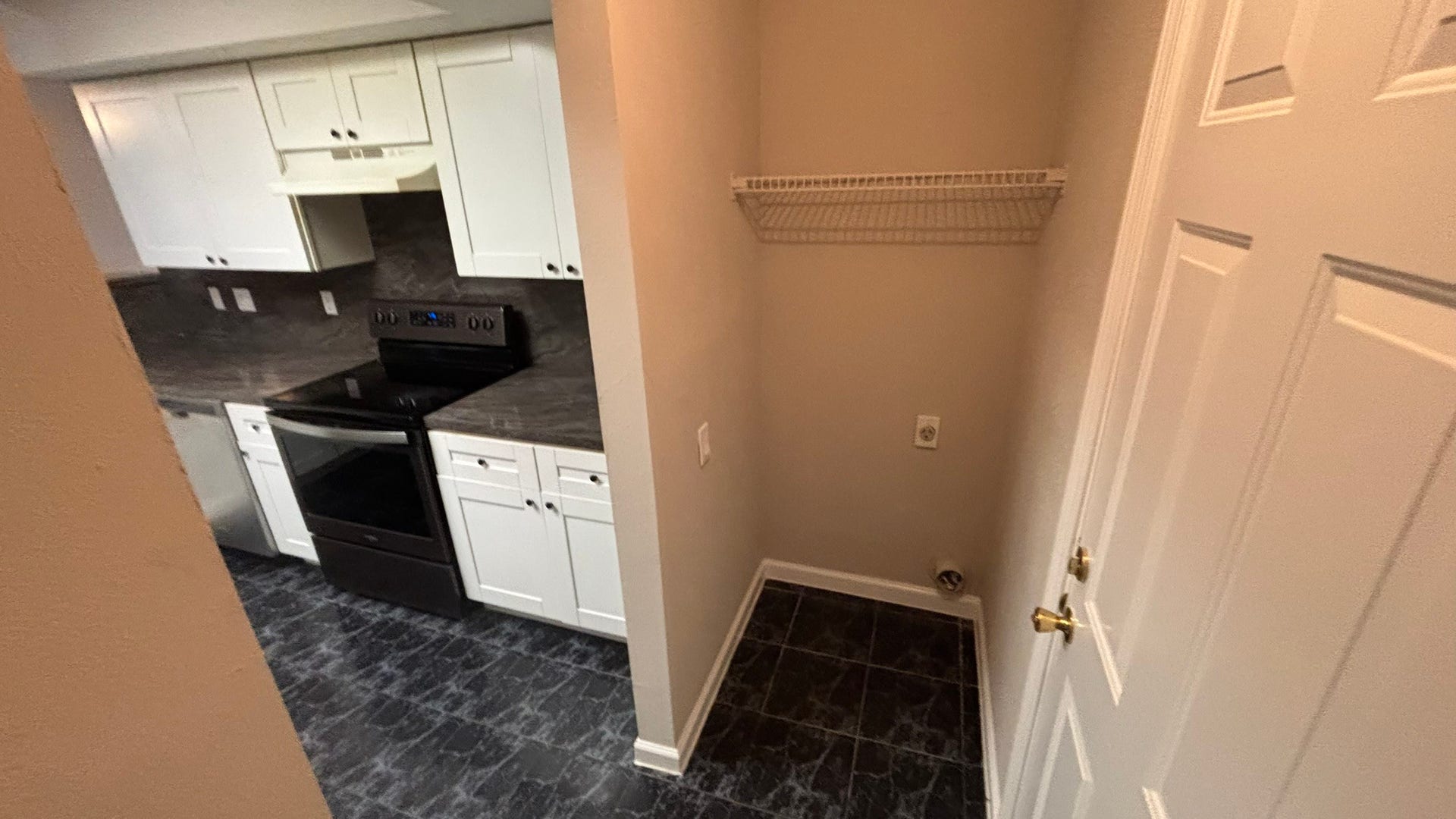 16610 Park Scot Drive Drive, Houston, TX 77084 Laundry room connected to kitchen and garage.