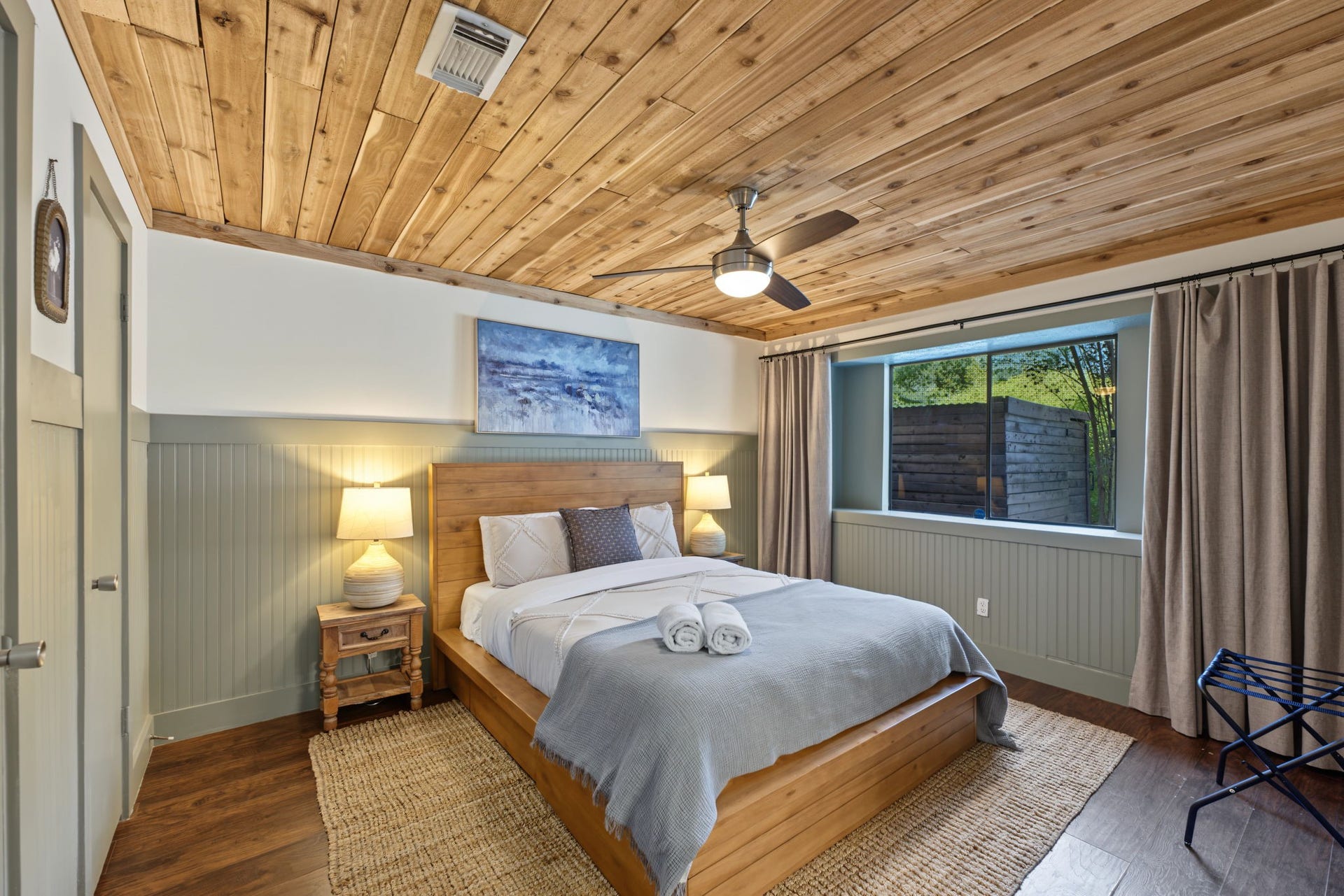 5006 Deer Point Drive, Spring, TX 77389 Downstairs primary retreat boasts a CEDAR PLANK CEILING, sage beadboard wainscoting and rich wood-look flooring!