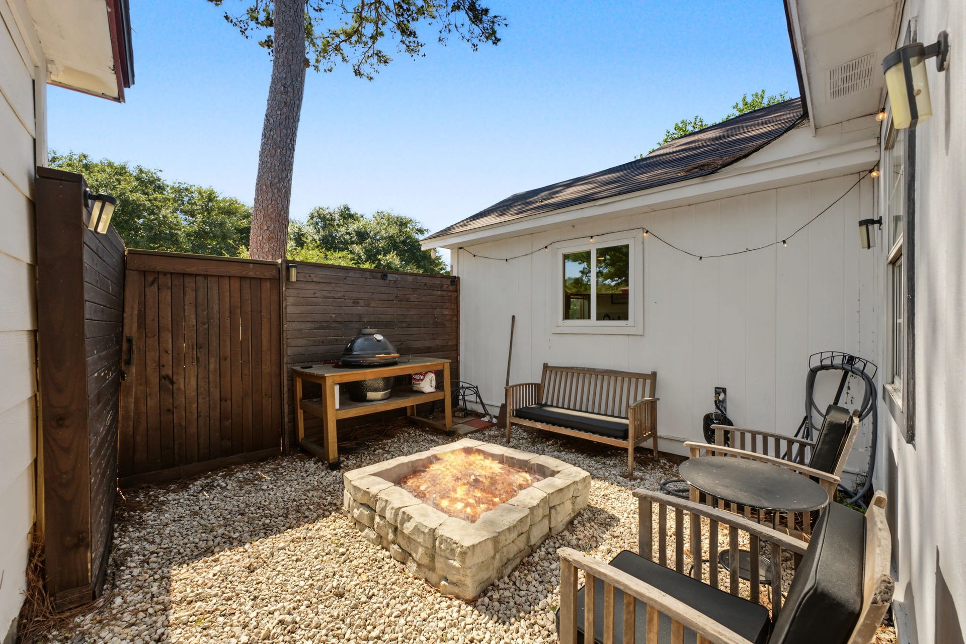 5006 Deer Point Drive, Spring, TX 77389 Private fire pit courtyard with pea gravel and privacy fencing. S'mores night, anyone?