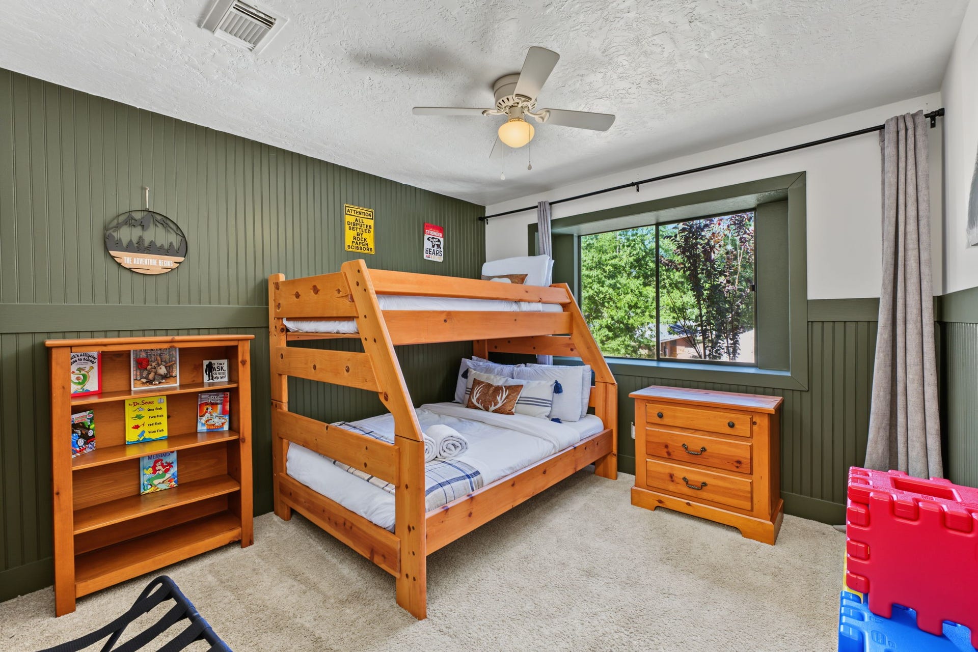 5006 Deer Point Drive, Spring, TX 77389 Secondary bedroom #3 boasts a deep green beadboard accent wall, perfect for a kids' room or playroom!