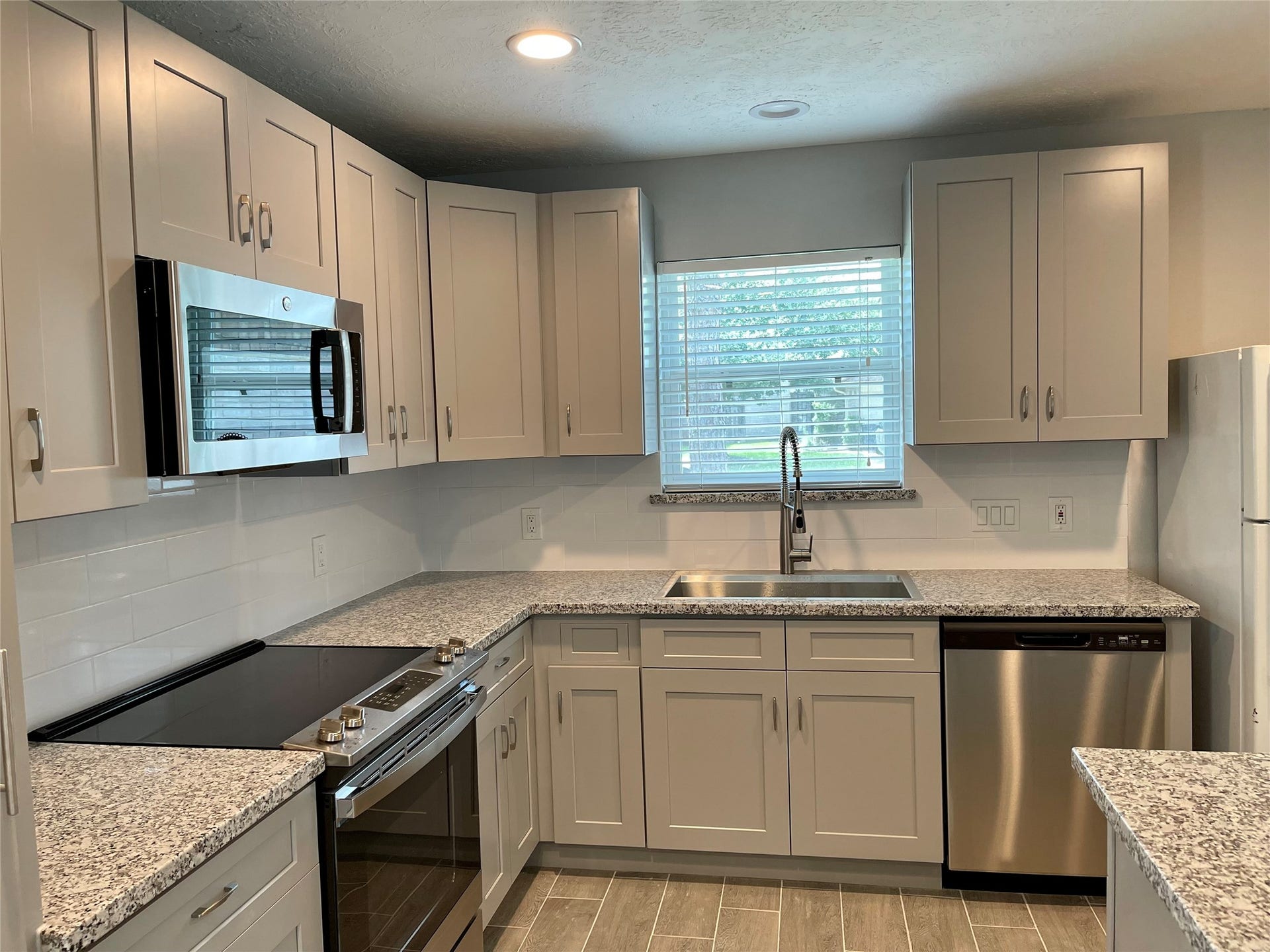 9415 Westacre Place, Houston, TX 77083 New Upgraded Kitchen with new cabinets granite countertops and stainless steel appliances
