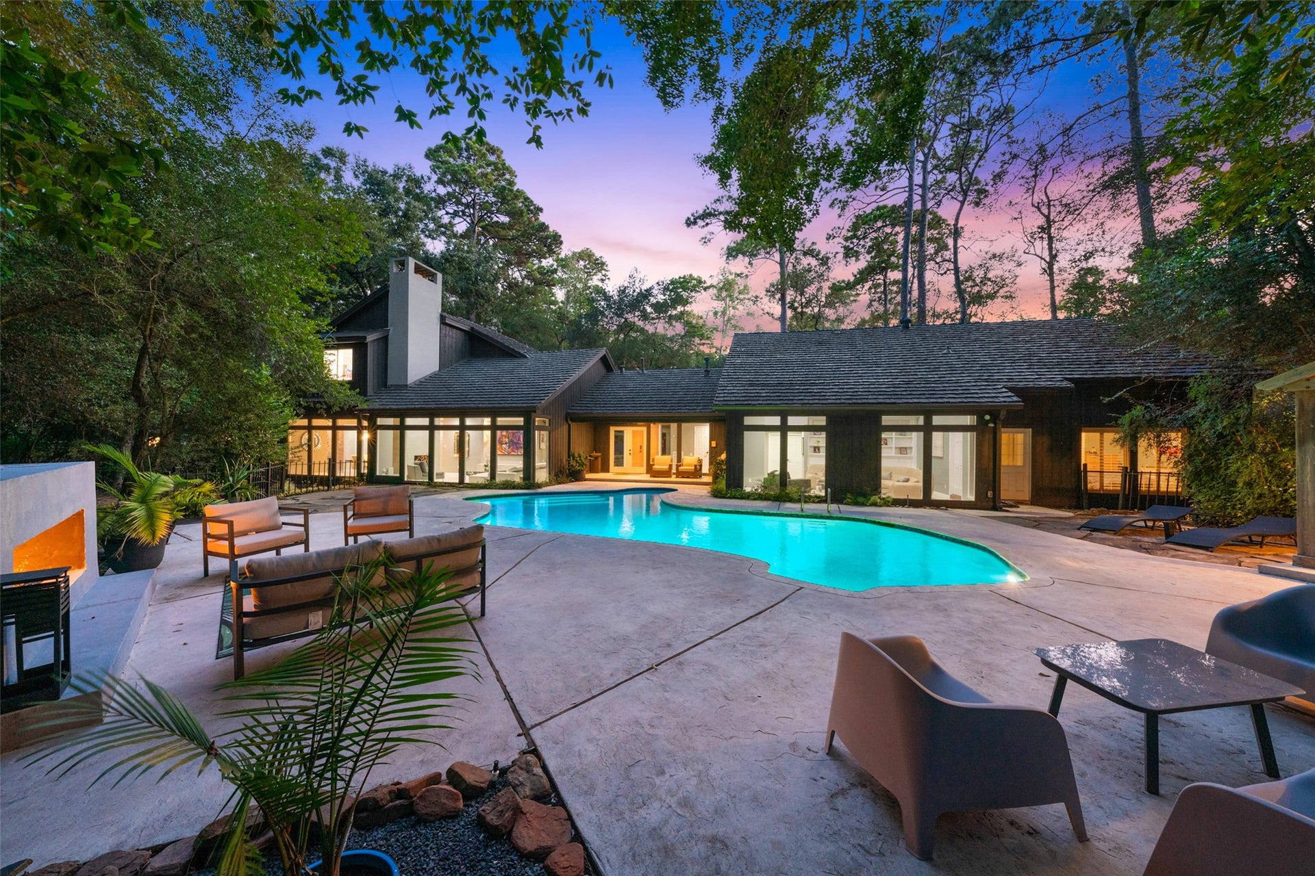 2411 Oakbank Drive, Kingwood, TX 77339 Enjoy early evening swims, then unwind by the warmth of the outdoor fireplace