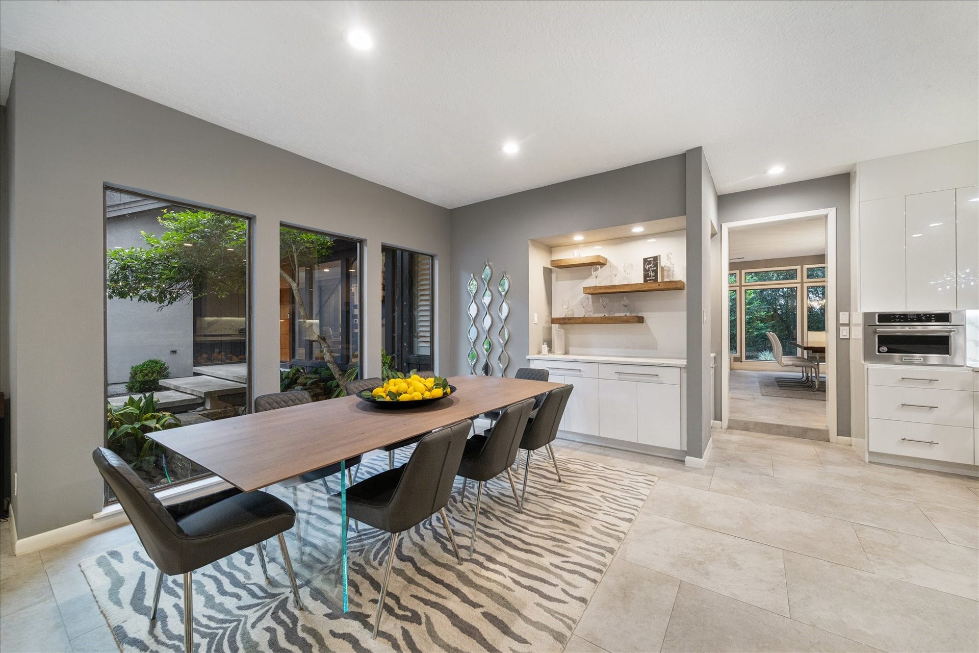 2411 Oakbank Drive, Kingwood, TX 77339 This beautiful breakfast room features large windows with garden views and opens to the kitchen