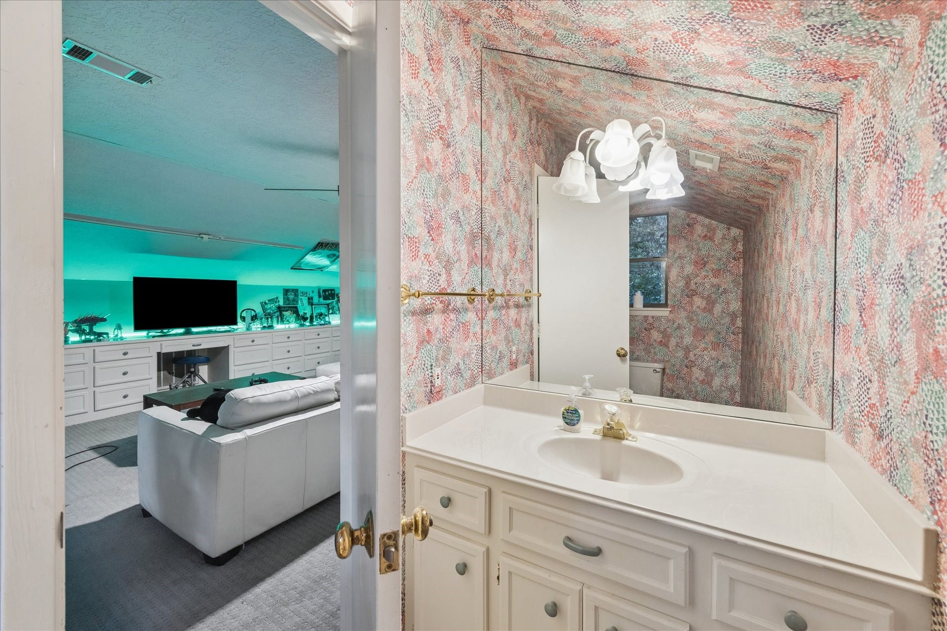 2411 Oakbank Drive, Kingwood, TX 77339 Bathroom next to the entertainment room.
