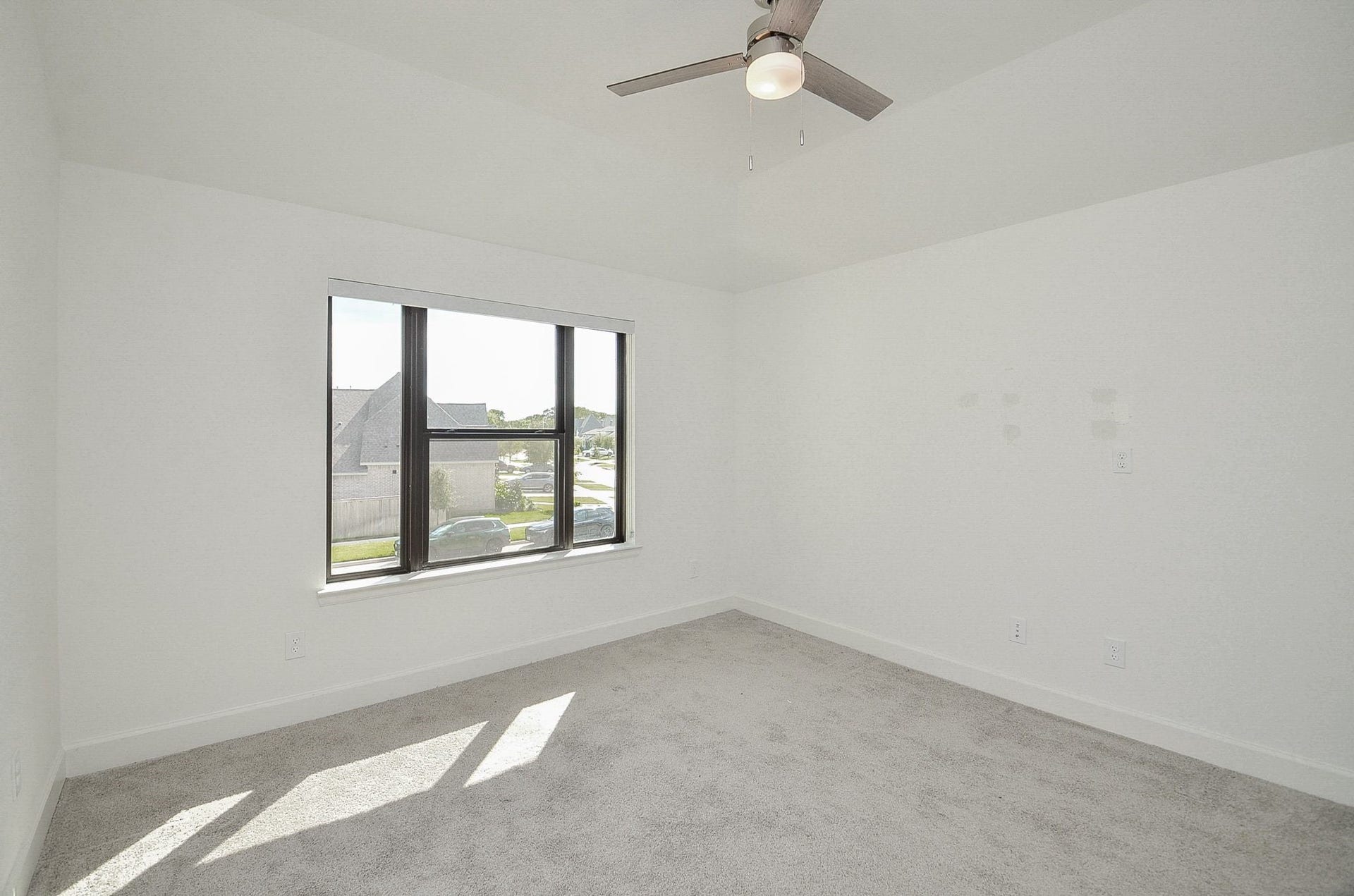 Another bright secondary bedroom offering flexible space for guests or a home office.