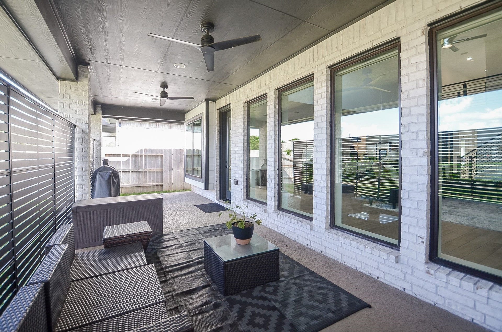 Another view of the spacious covered patio, ideal for outdoor entertaining and relaxation.
