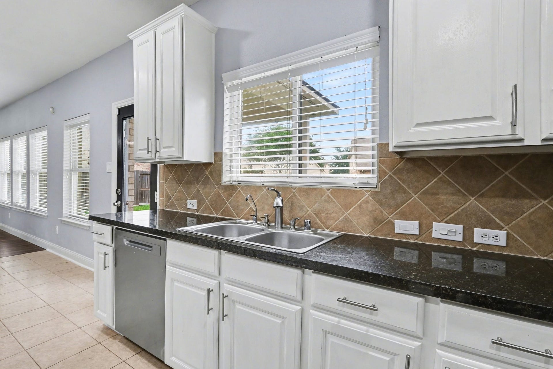 2705 Golden Creek Lane, Pearland, TX 77584 Perched above the sink, is this charming window making any task at hand more pleasant!