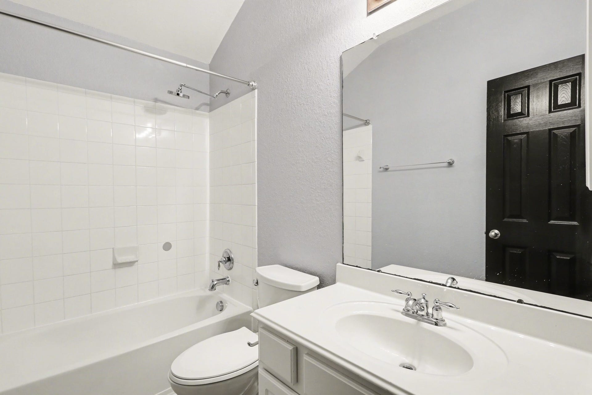 2705 Golden Creek Lane, Pearland, TX 77584 A full-sized secondary bathroom features a shower/tub combination with tile surround that is so easy to maintain!