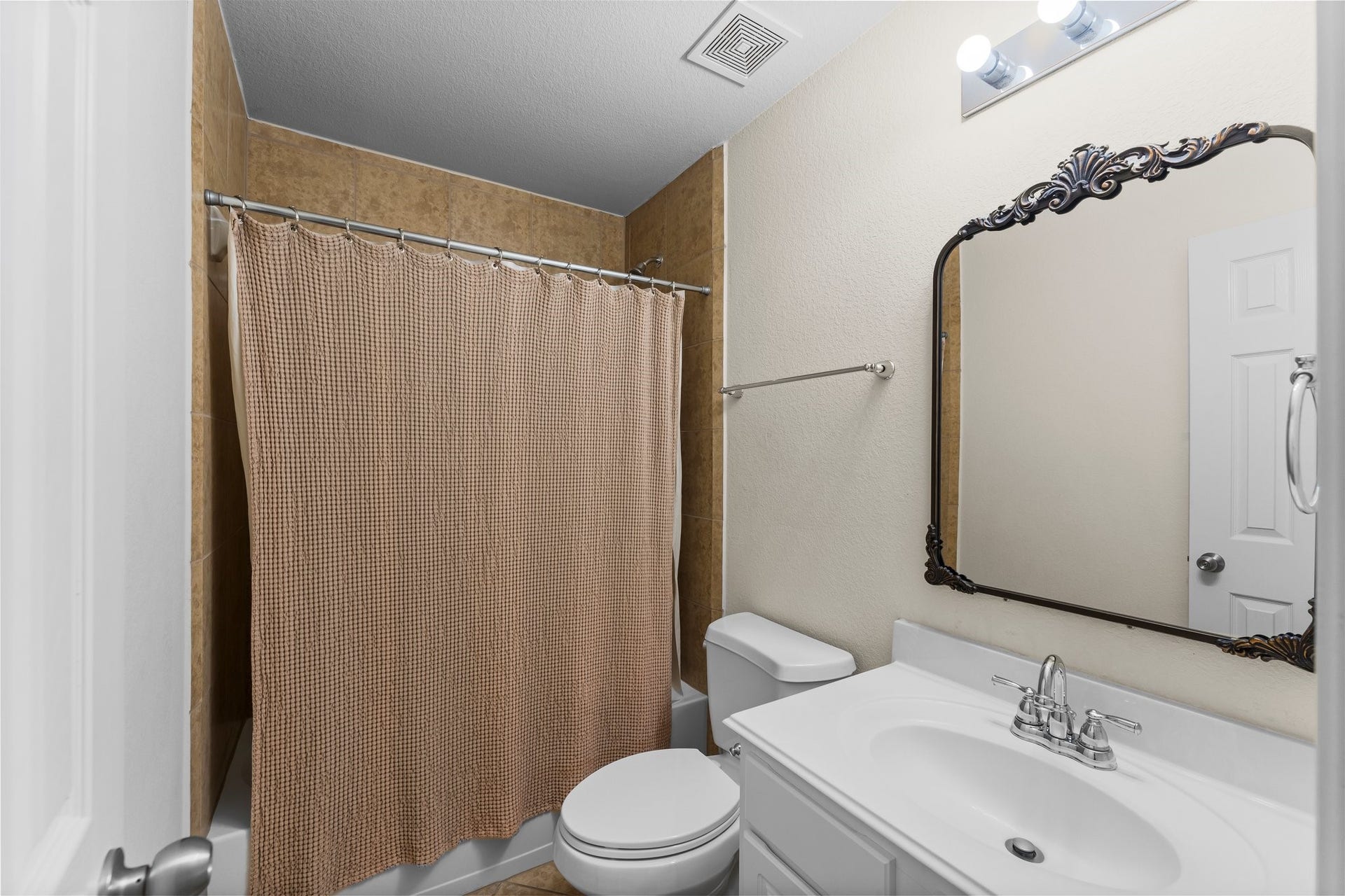 Full bathroom with shower and tub combo.