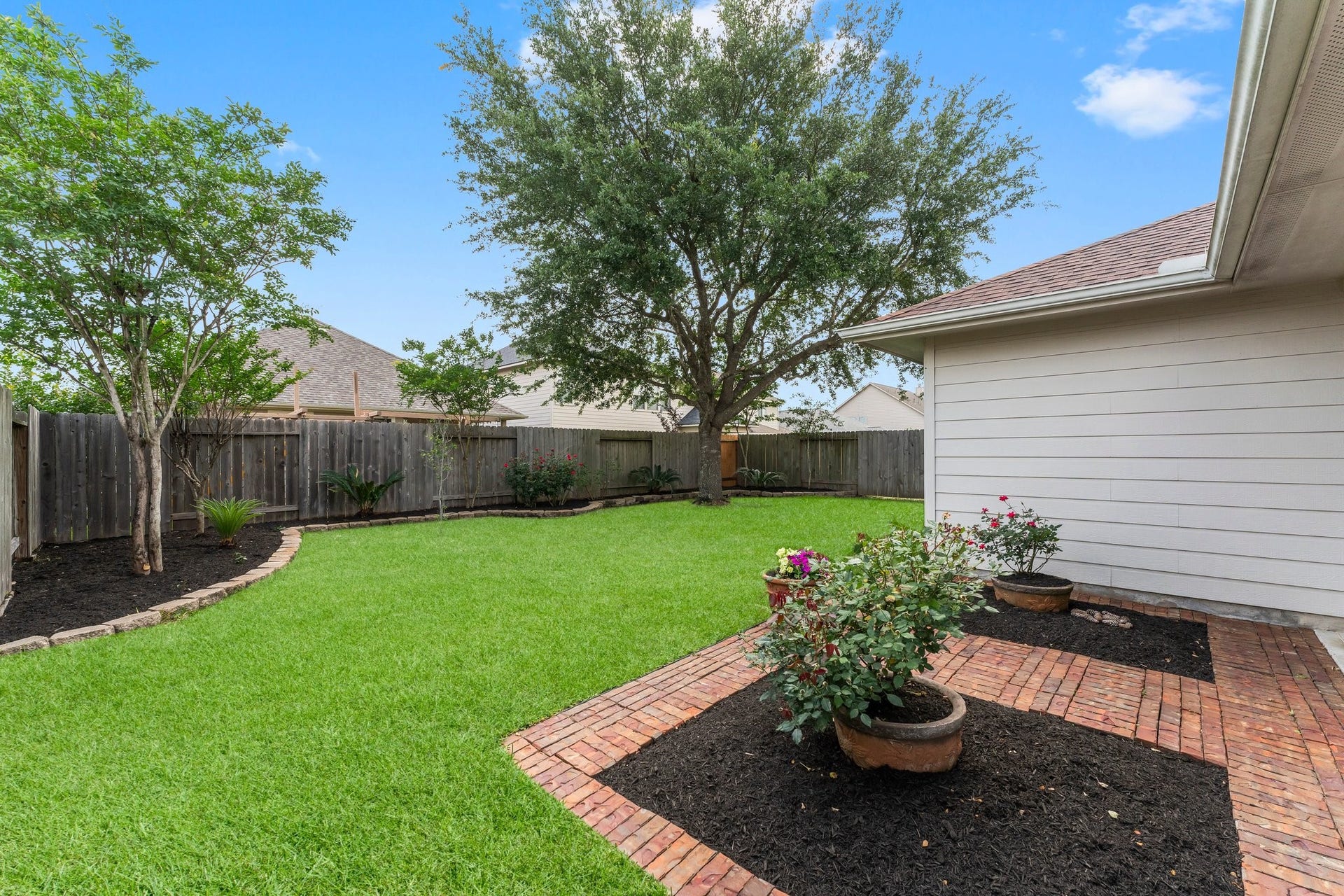 This backyard is perfect for outdoor relaxation and entertainment.