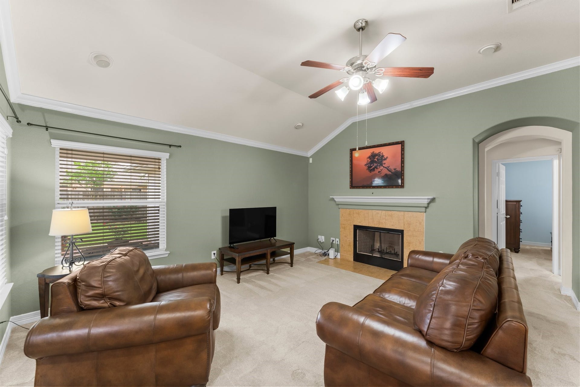 The cozy fireplace is the perfect focal point of the family room.