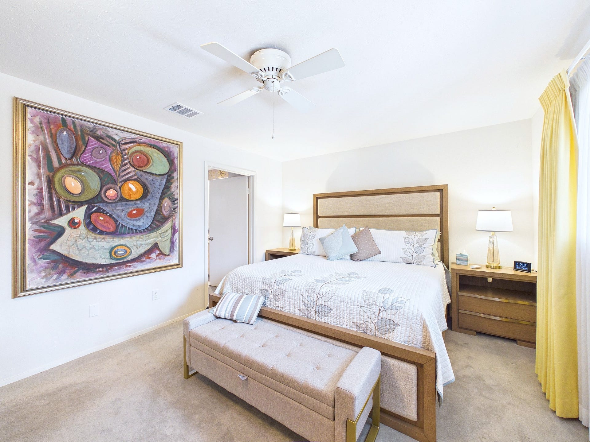 Bright and inviting primary suite with lush carpeting and a cozy feel.