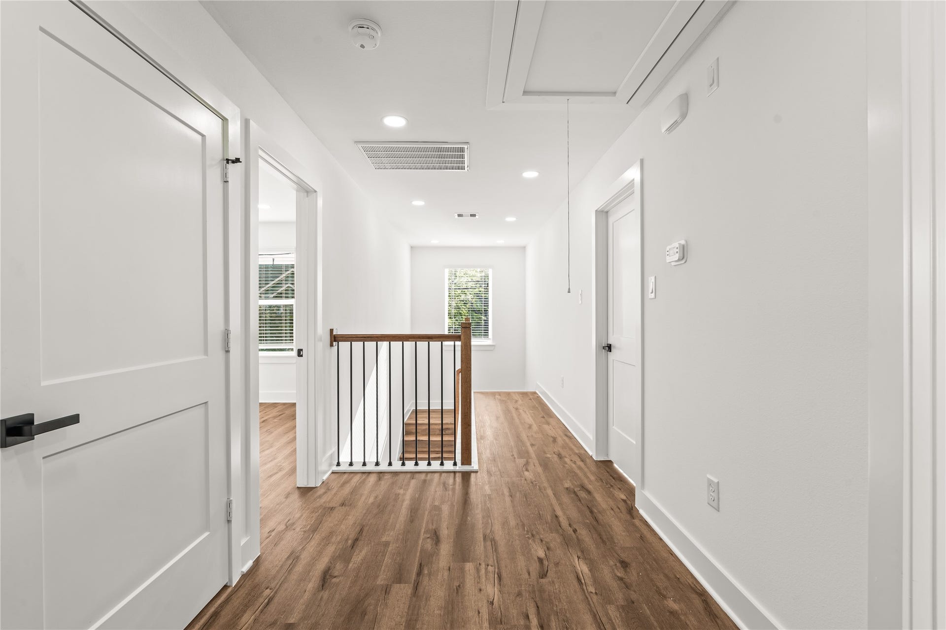 1912 Schweikhardt Street, Houston, TX 77020 Thoughtful zoning. The upper level separates the bedrooms seamlessly with a clean, bright corridor anchored by beautiful iron spindle details.