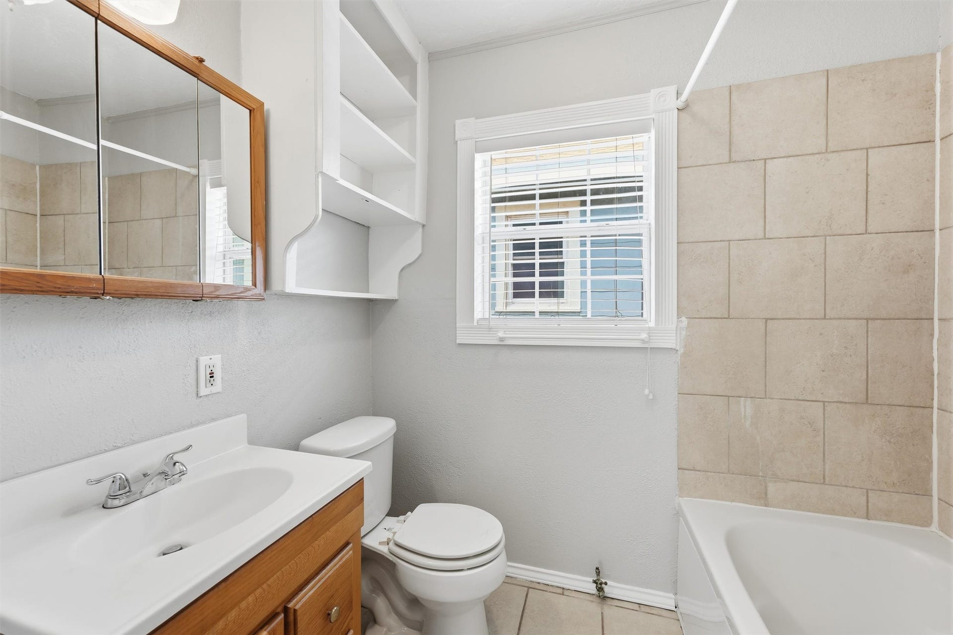 4823 Bernardo De Galvez, Galveston, TX 77551 Bathroom with jetted tub/shower combo.