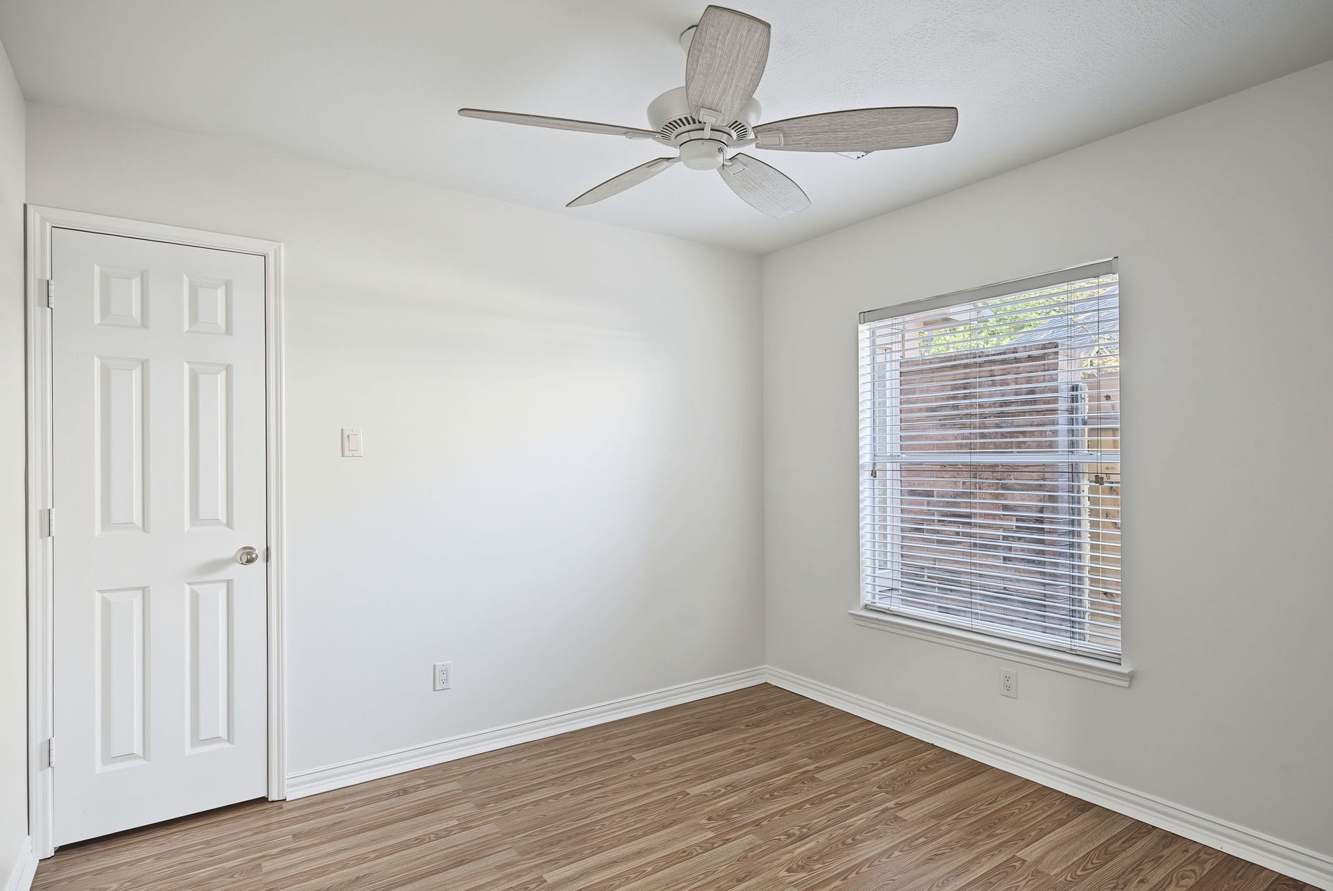 51 Pinery Ridge Place, The Woodlands, TX 77382 A secondary bedroom offers natural light, a closet, and a simple palette that works with a variety of decorating styles.