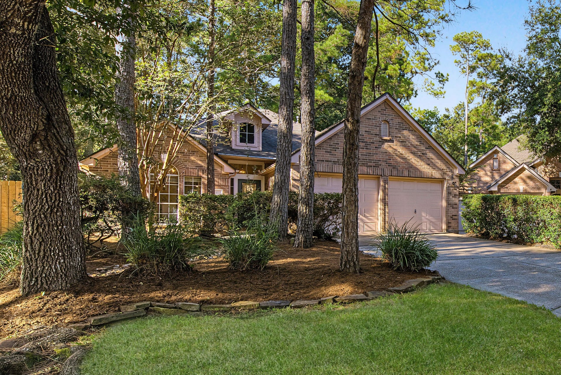 51 Pinery Ridge Place, The Woodlands, TX 77382 Welcome to 51 Pinery Ridge Place - classic brick charm, mature trees, and refreshed landscaping in Alden Bridge, approximately a five-minute walk to Bush Elementary.