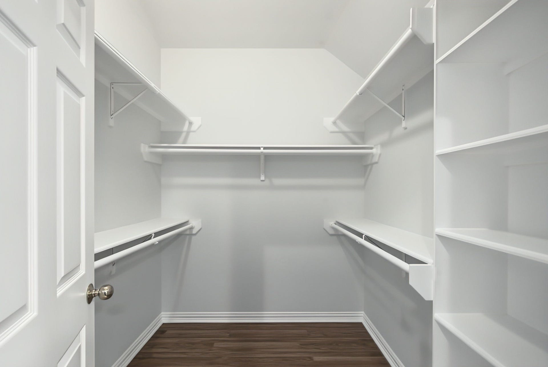 51 Pinery Ridge Place, The Woodlands, TX 77382 The walk-in closet features hanging space on both sides and built-in shelving for shoes, accessories, and everyday organization.