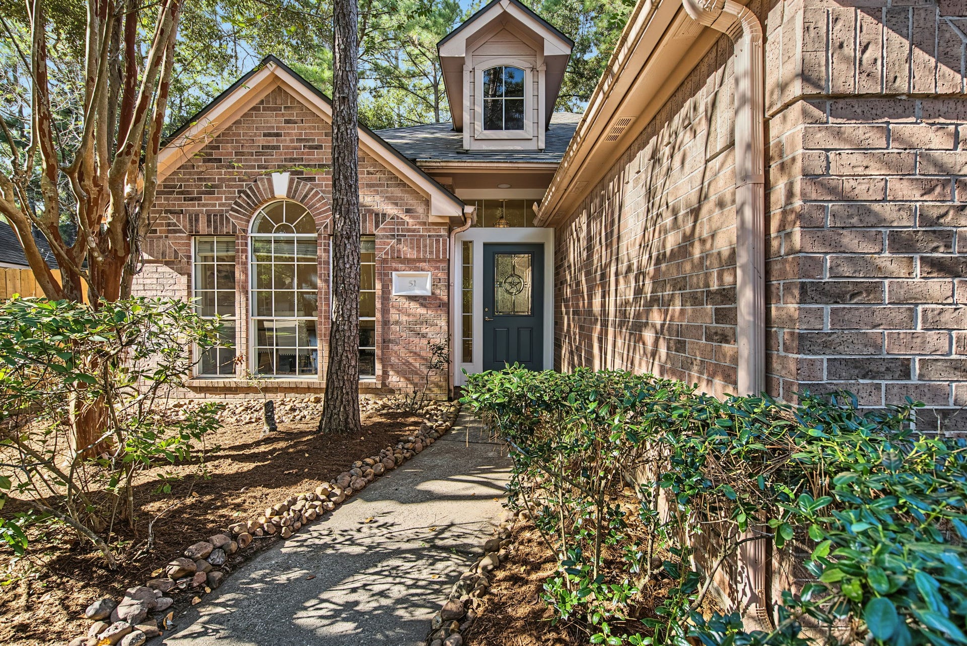 51 Pinery Ridge Place, The Woodlands, TX 77382 An established tree canopy frames this single-story Alden Bridge home. Major improvements include a roof replaced in December 2025 and AC replaced in May 2025.