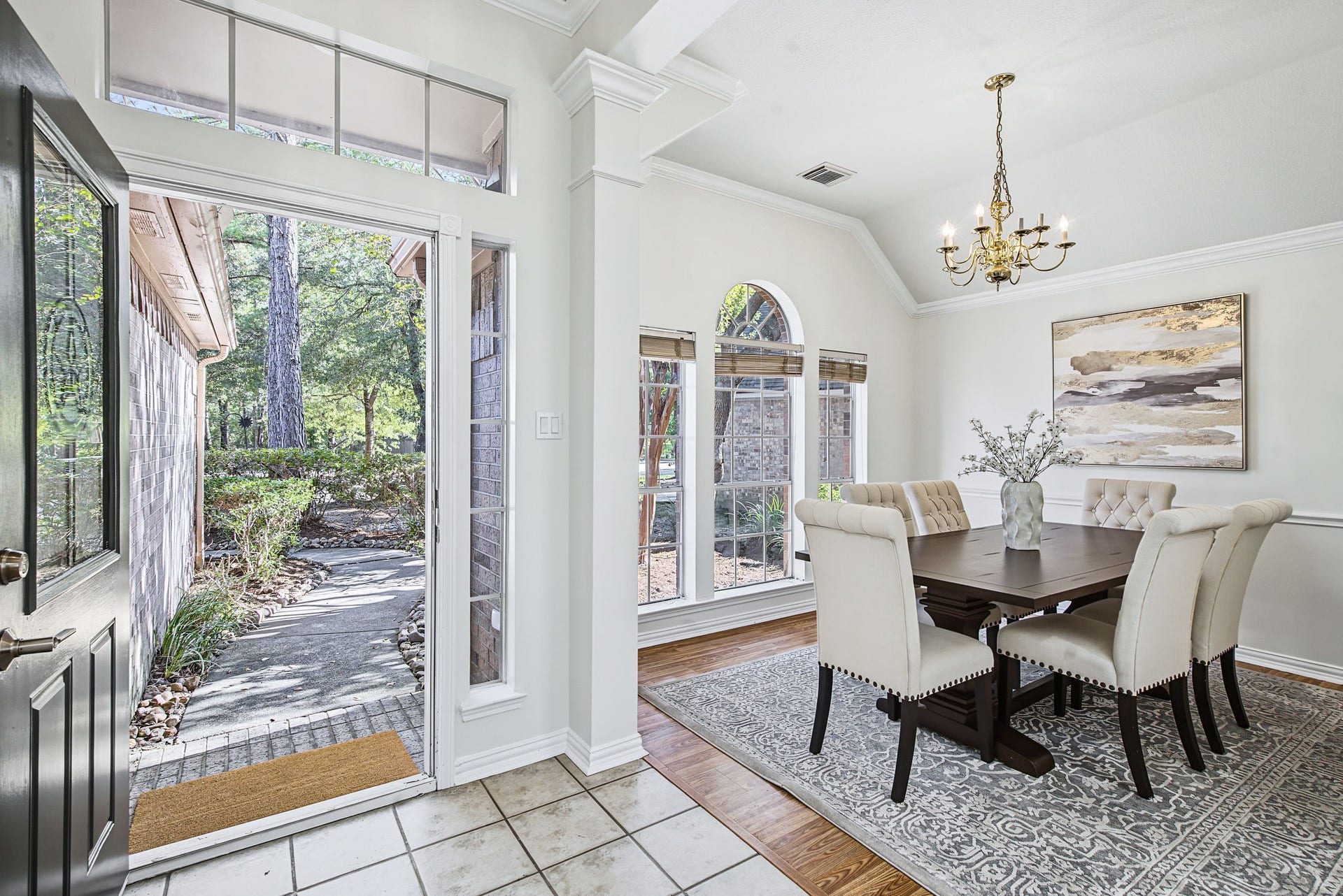 51 Pinery Ridge Place, The Woodlands, TX 77382 Just off the entry, the dining room welcomes guests with tall windows, natural light, and views of the landscaped front yard.