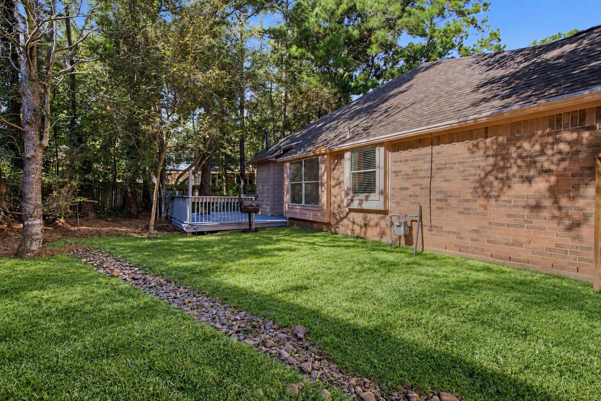 51 Pinery Ridge Place, The Woodlands, TX 77382 Reimagined sideyard with new sod installed.