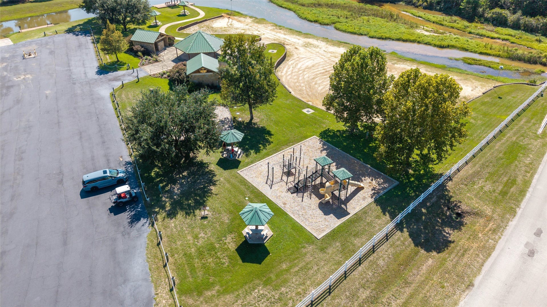 0 Ridgelake Court, Montgomery, TX 77316 Enjoy a serene community park featuring a playground, picnic areas, and lush greenery, perfect for outings and outdoor activities.
