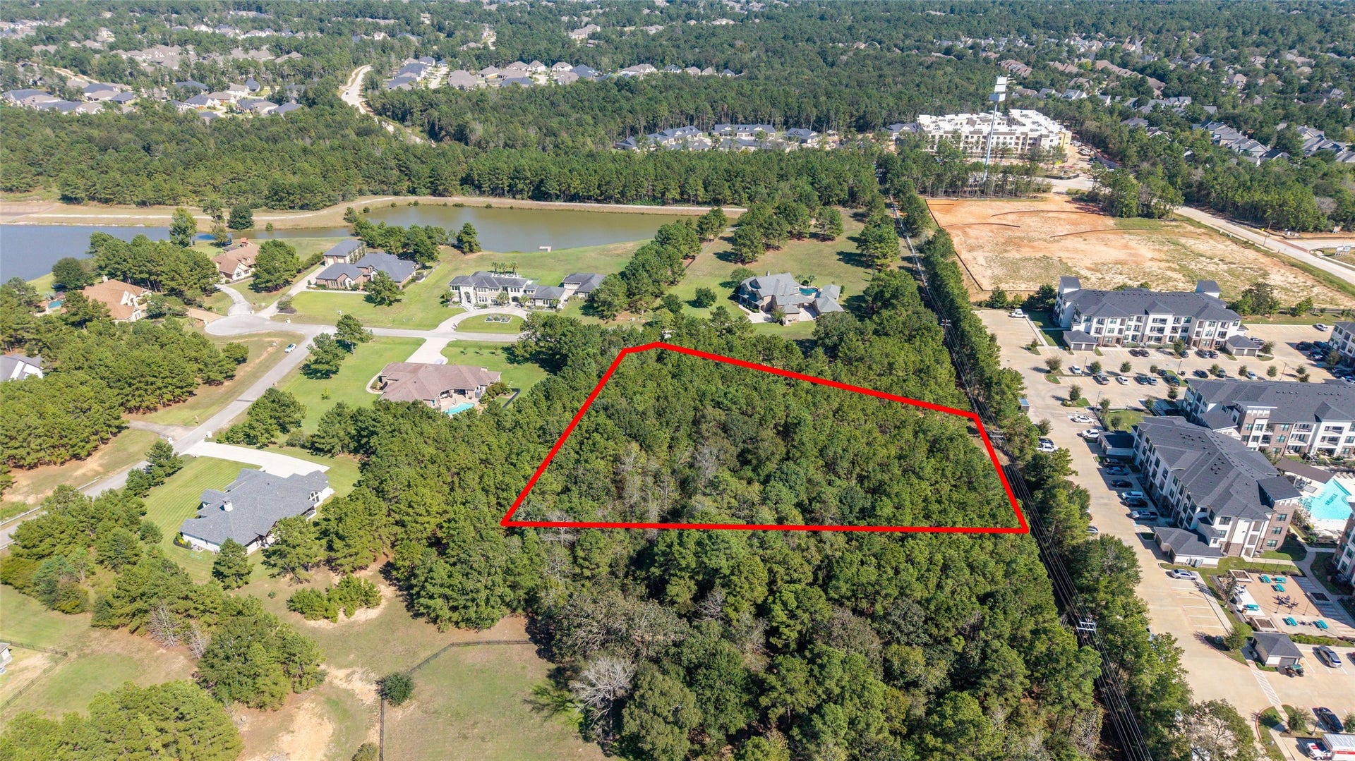 0 Ridgelake Court, Montgomery, TX 77316 Expansive wooded lot in a serene neighborhood, offering privacy and potential for custom home development amidst lush greenery.