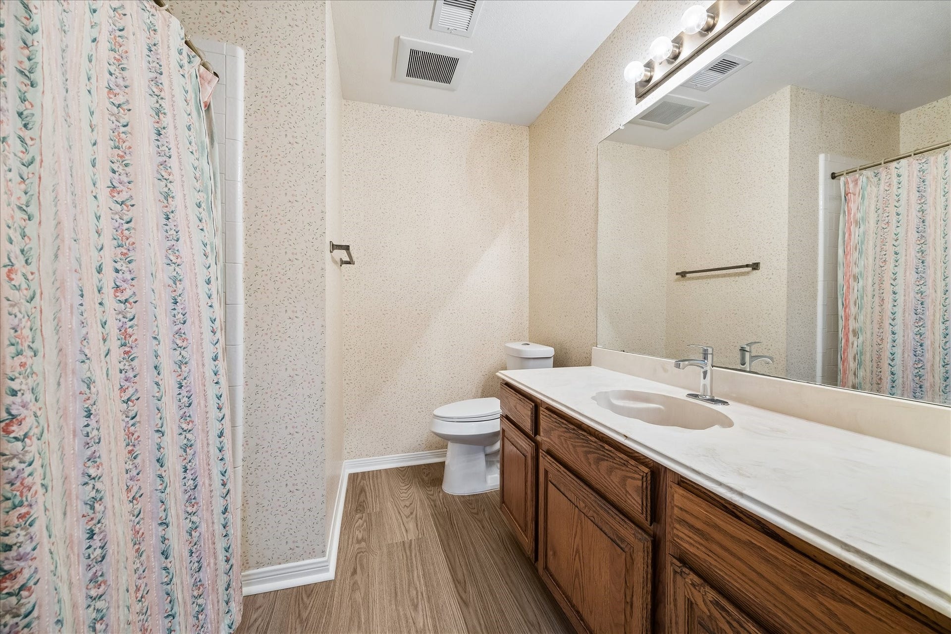 15503 Ensenada Drive, Houston, TX 77083 Full bathroom off the hallway with new flooring and refinished cabinets