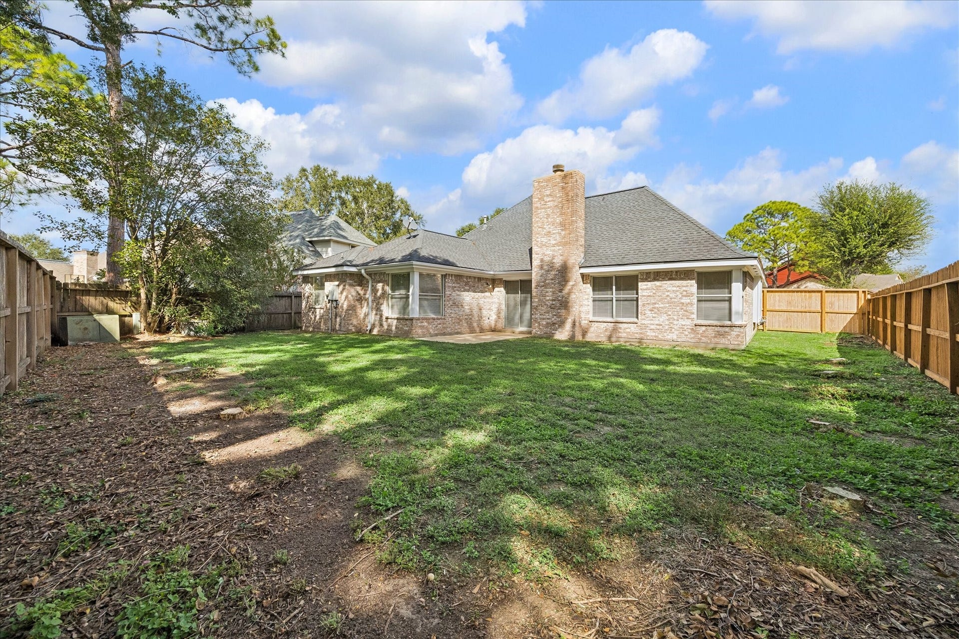 15503 Ensenada Drive, Houston, TX 77083 This spacious backyard offers endless possibilities for entertaining