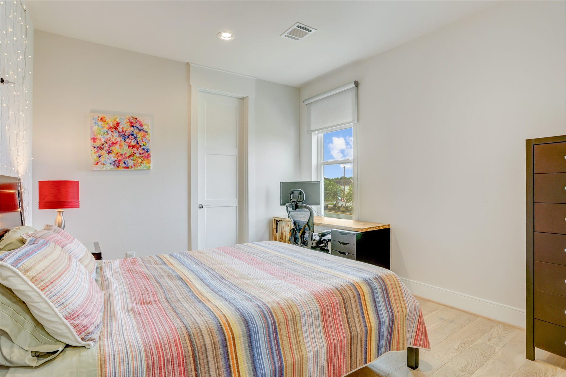 9820 Mocking Bird Hill Lane, Houston, TX 77080 Bright and inviting guest bedroom featuring a cozy, with a window view.