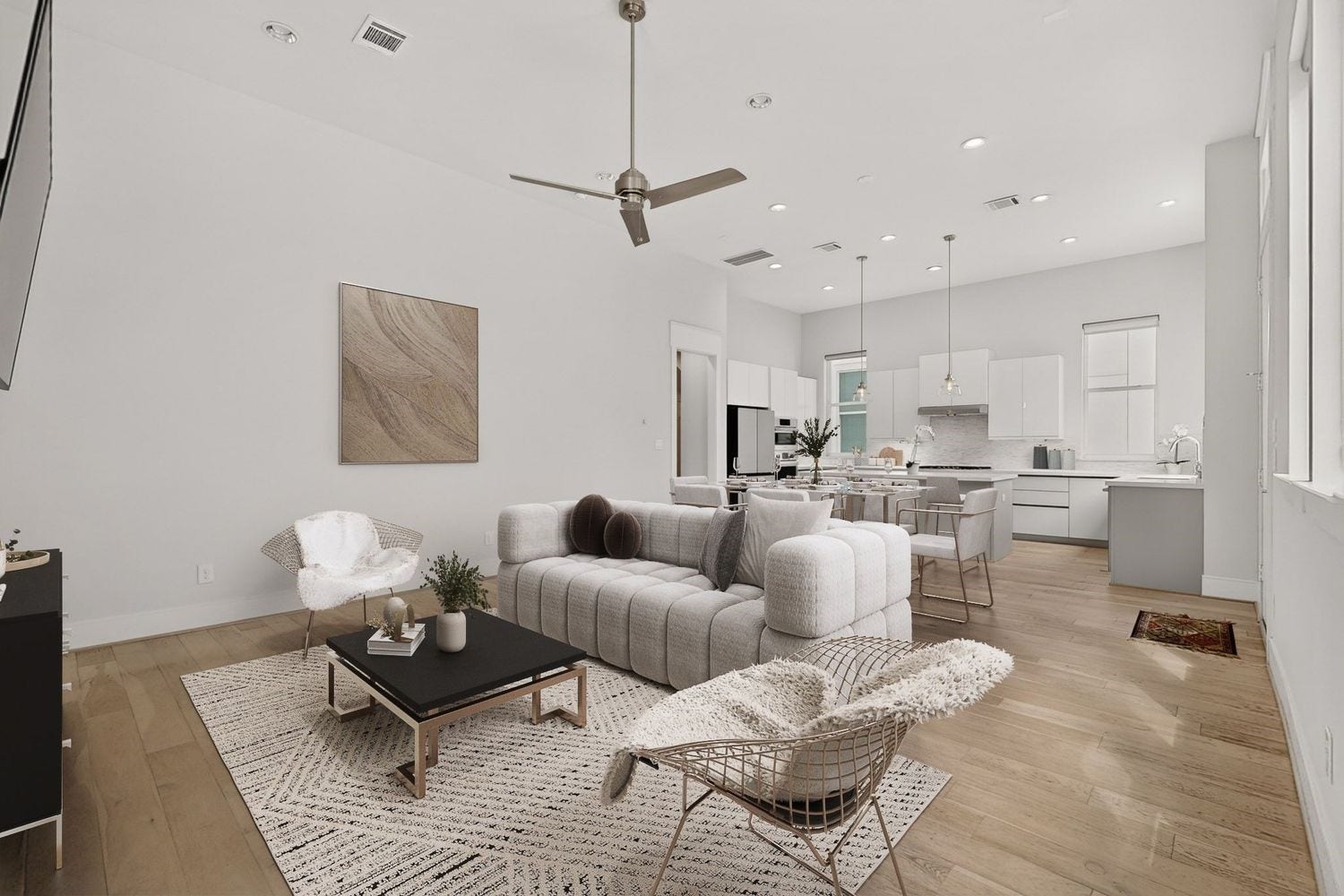 9820 Mocking Bird Hill Lane, Houston, TX 77080 Experience modern elegance in this open-concept living space, featuring sleek light wood floors, a minimalist kitchen with high-end finishes, and ample natural light throughout.