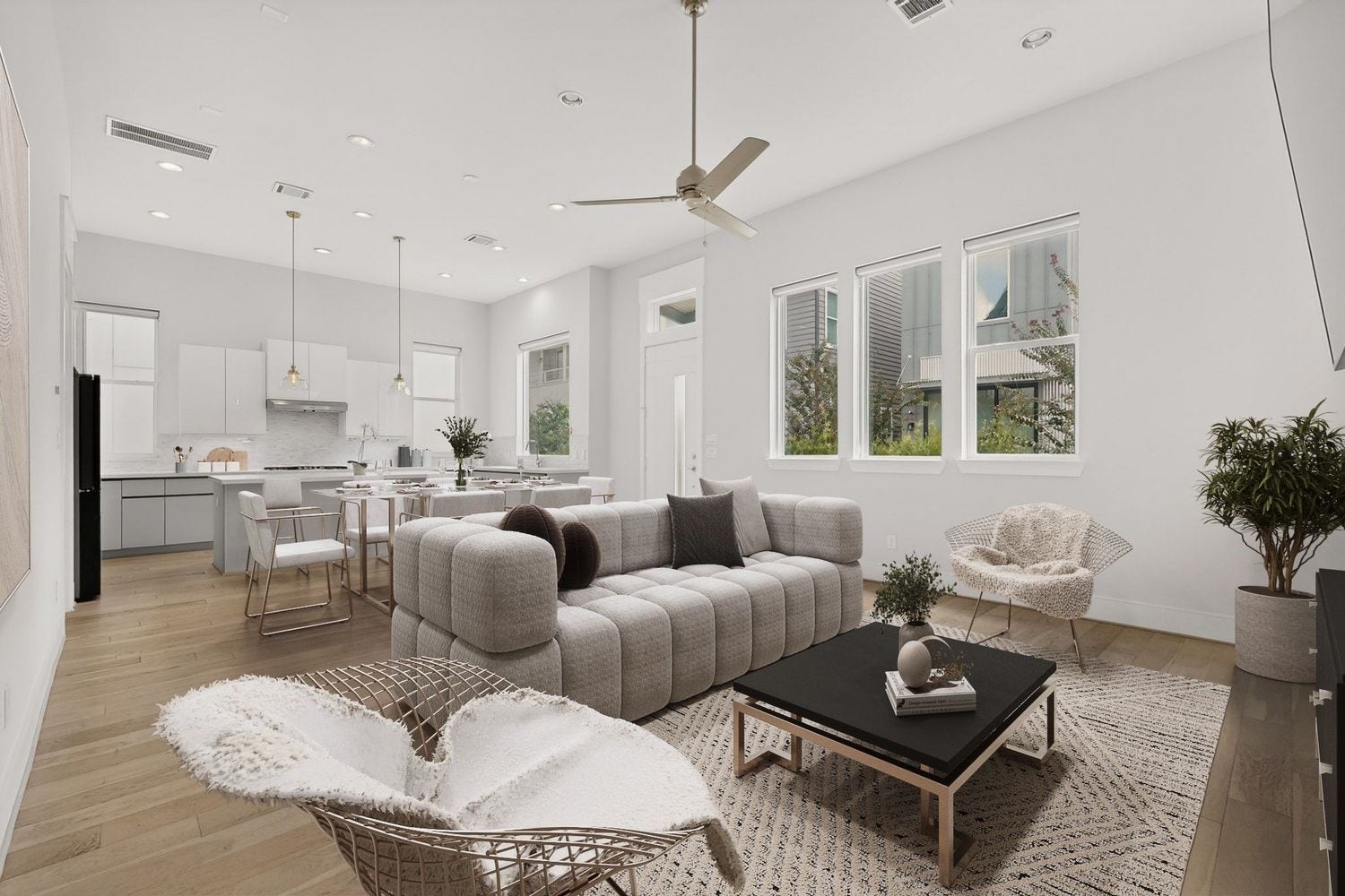 9820 Mocking Bird Hill Lane, Houston, TX 77080 Discover a spacious open-concept living area with abundant natural light, featuring modern finishes and a seamless flow from the stylish kitchen to the cozy lounge space.