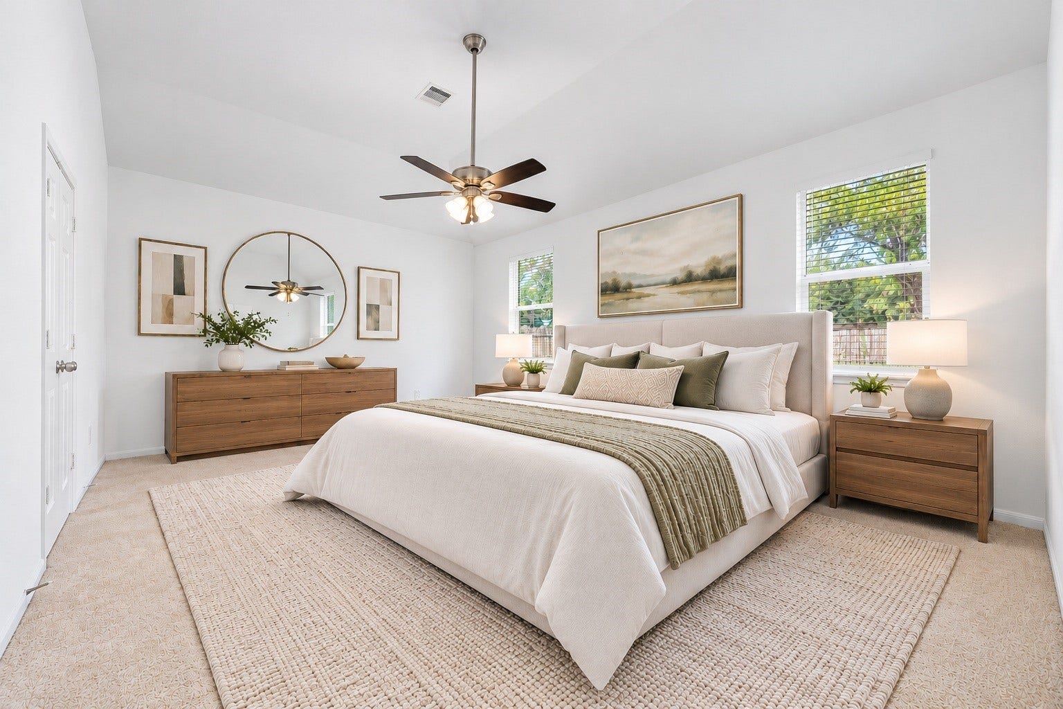26311 Smokey Valley Lane, Katy, TX 77494 Retreat to the spacious primary bedroom, where a vaulted ceiling, a ceiling fan with light, and plush carpet create a restful space. Two windows dressed in new blinds frame views of mature trees. Virtually staged.