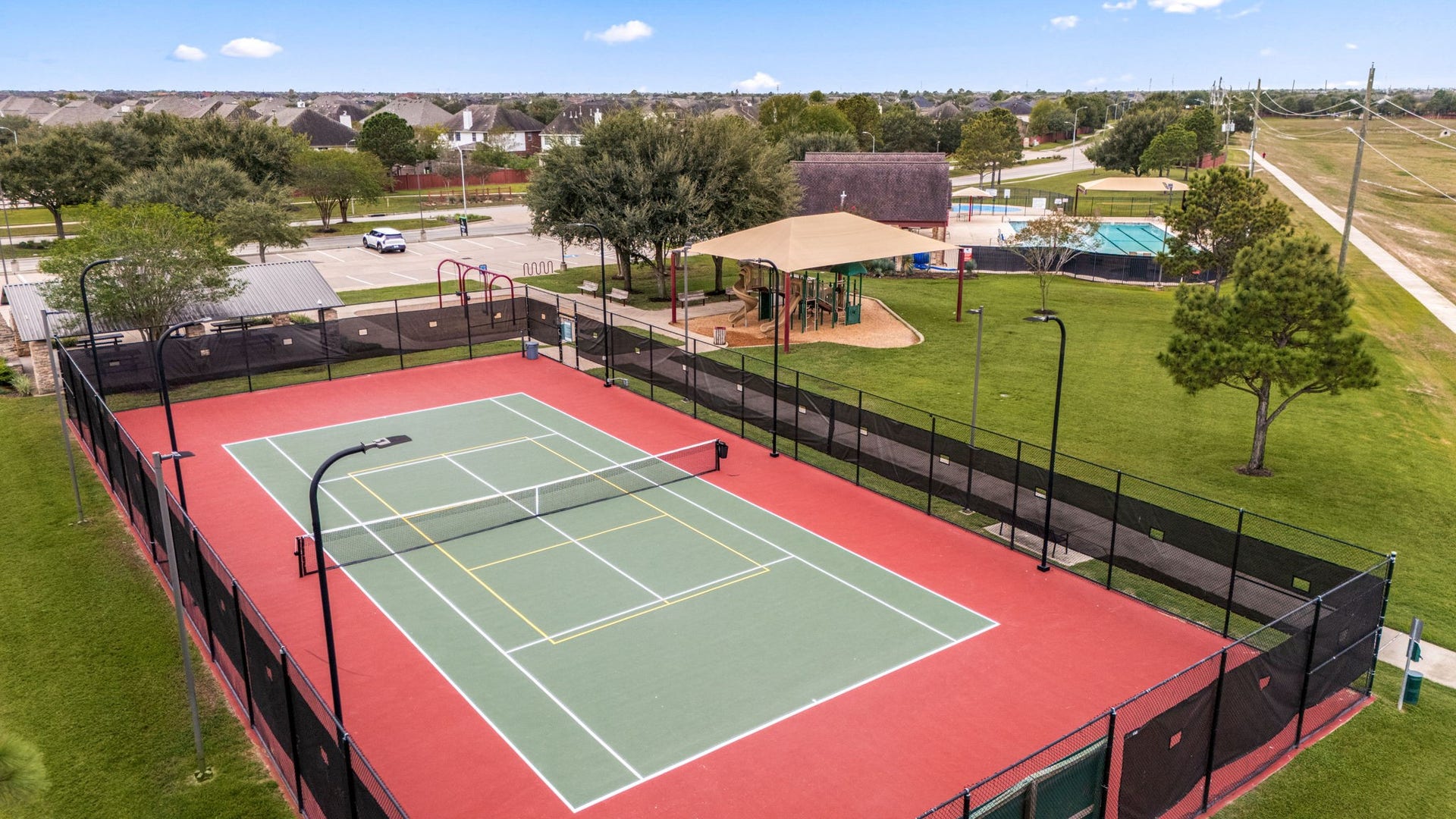 26311 Smokey Valley Lane, Katy, TX 77494 Silver Ranchs fenced, lighted recreation court is marked for both tennis and pickleball. The court is conveniently positioned beside the community playground and pool complex.